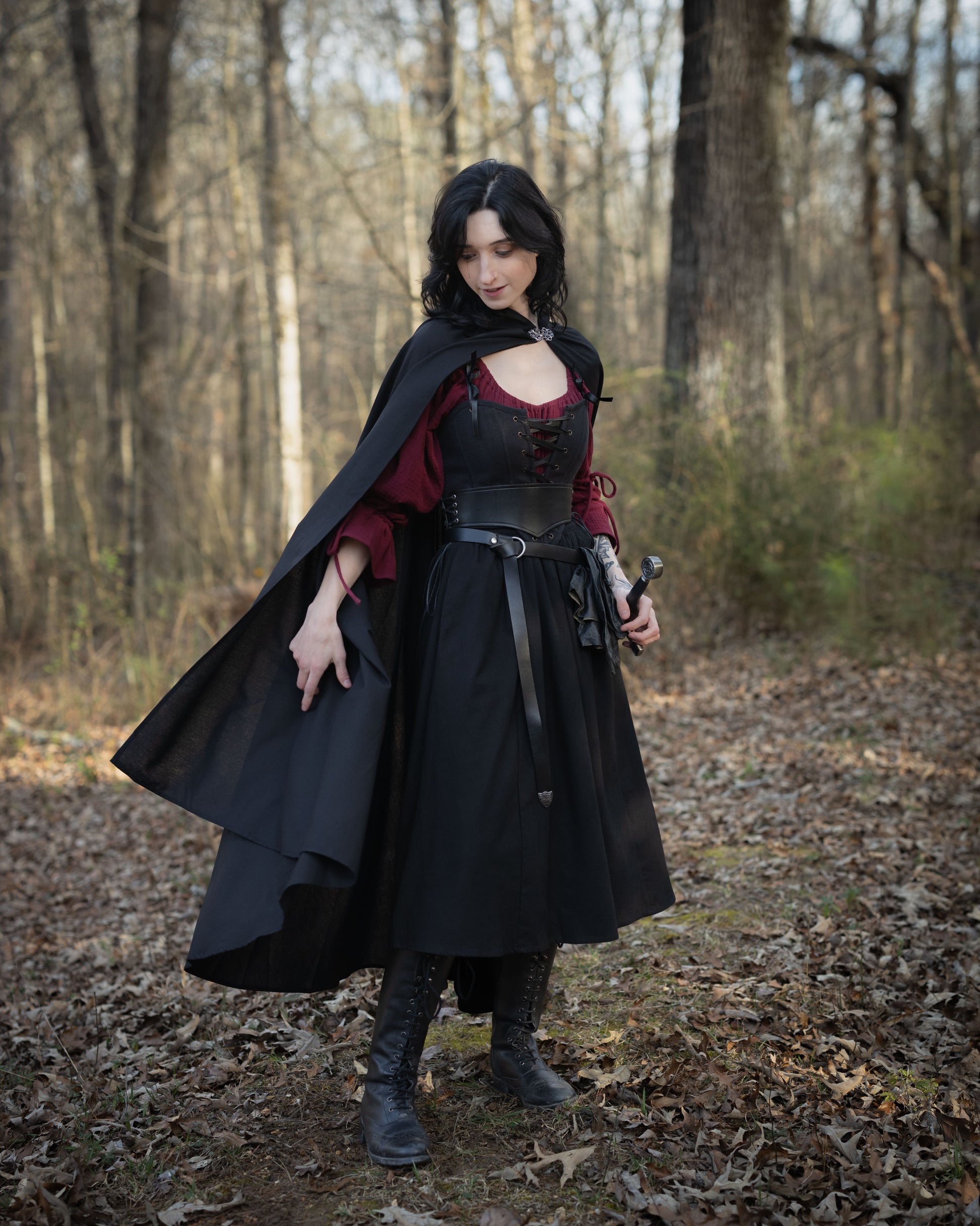 Black Cotton Midi Skirt styled with cloak and corset in forest setting, displaying medieval renaissance costume look
