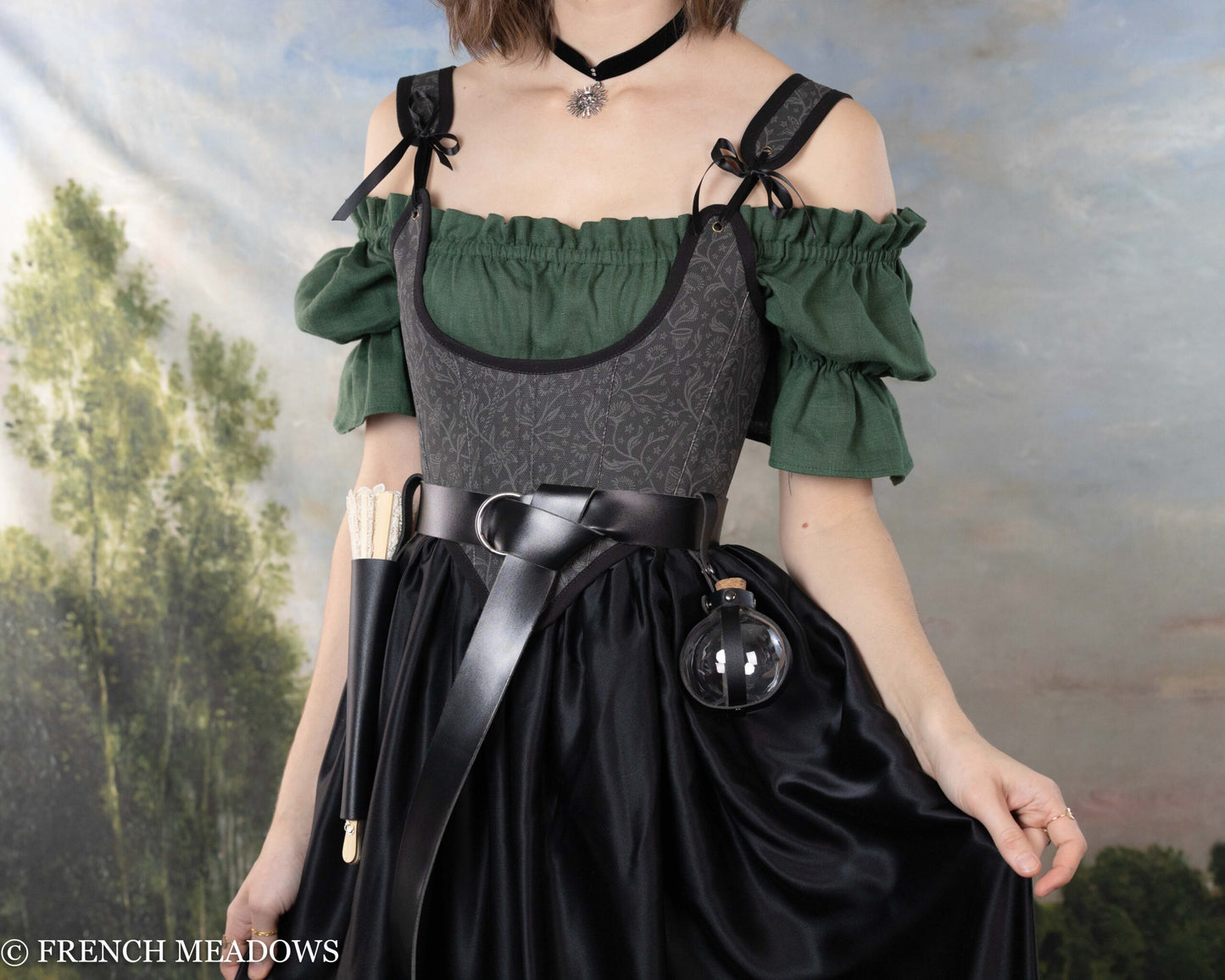 Black Tarot Underbust Bodice shown with green peasant top, styled for renaissance faire or witchy aesthetic