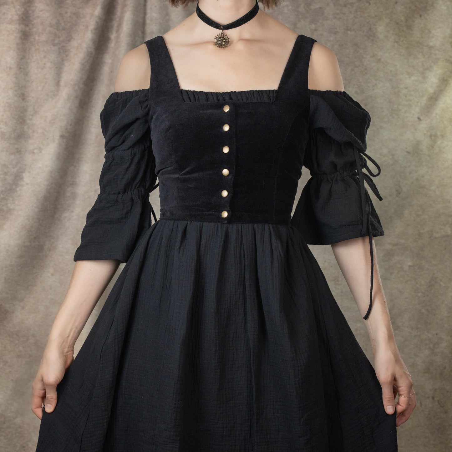 Black Cotton Puff Sleeve Chemise with off-shoulder design, button front bodice, and adjustable sleeve ties in renaissance style