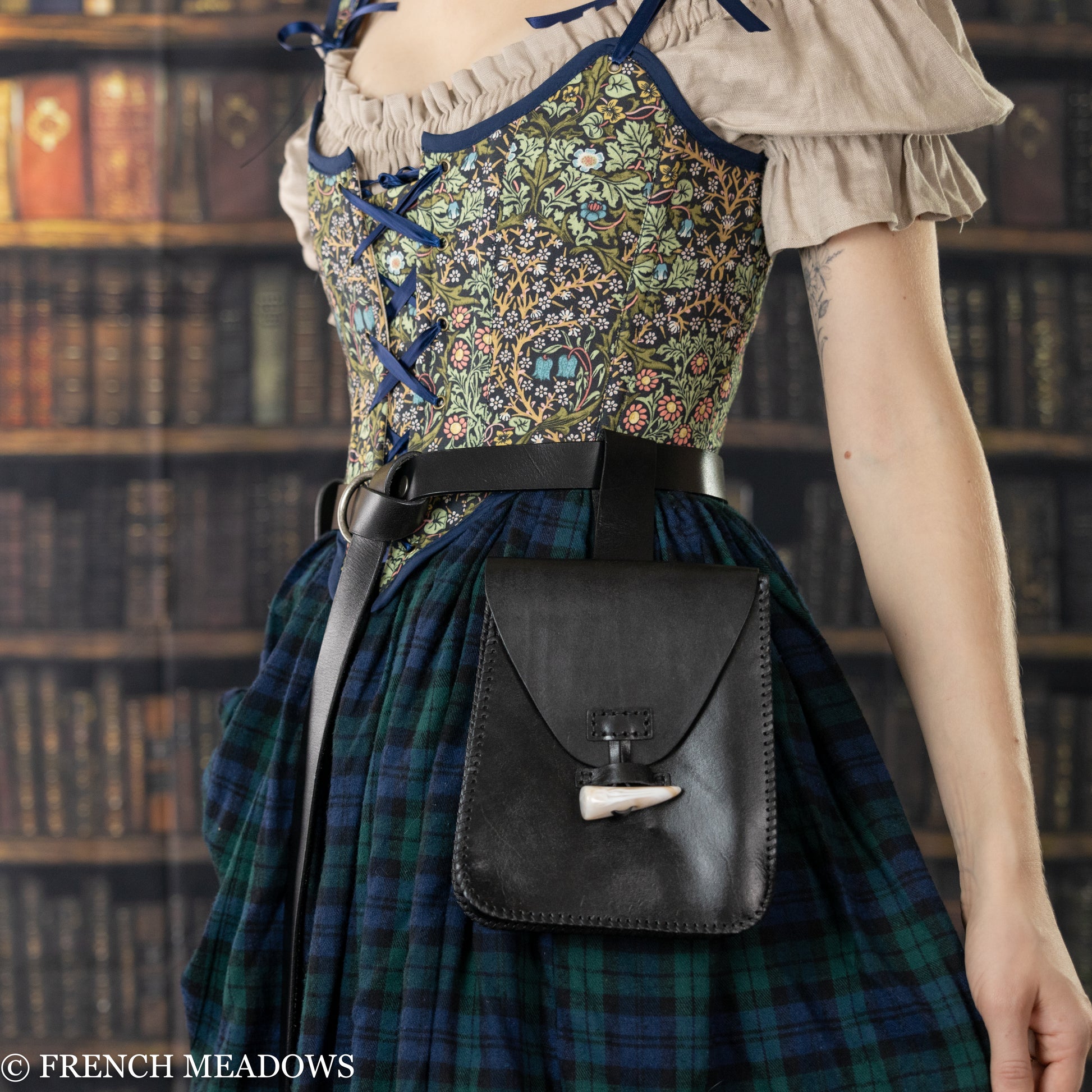 Leather Belt Pouch with horn toggle closure worn on plaid dress, showcasing medieval-style craftsmanship and practical design