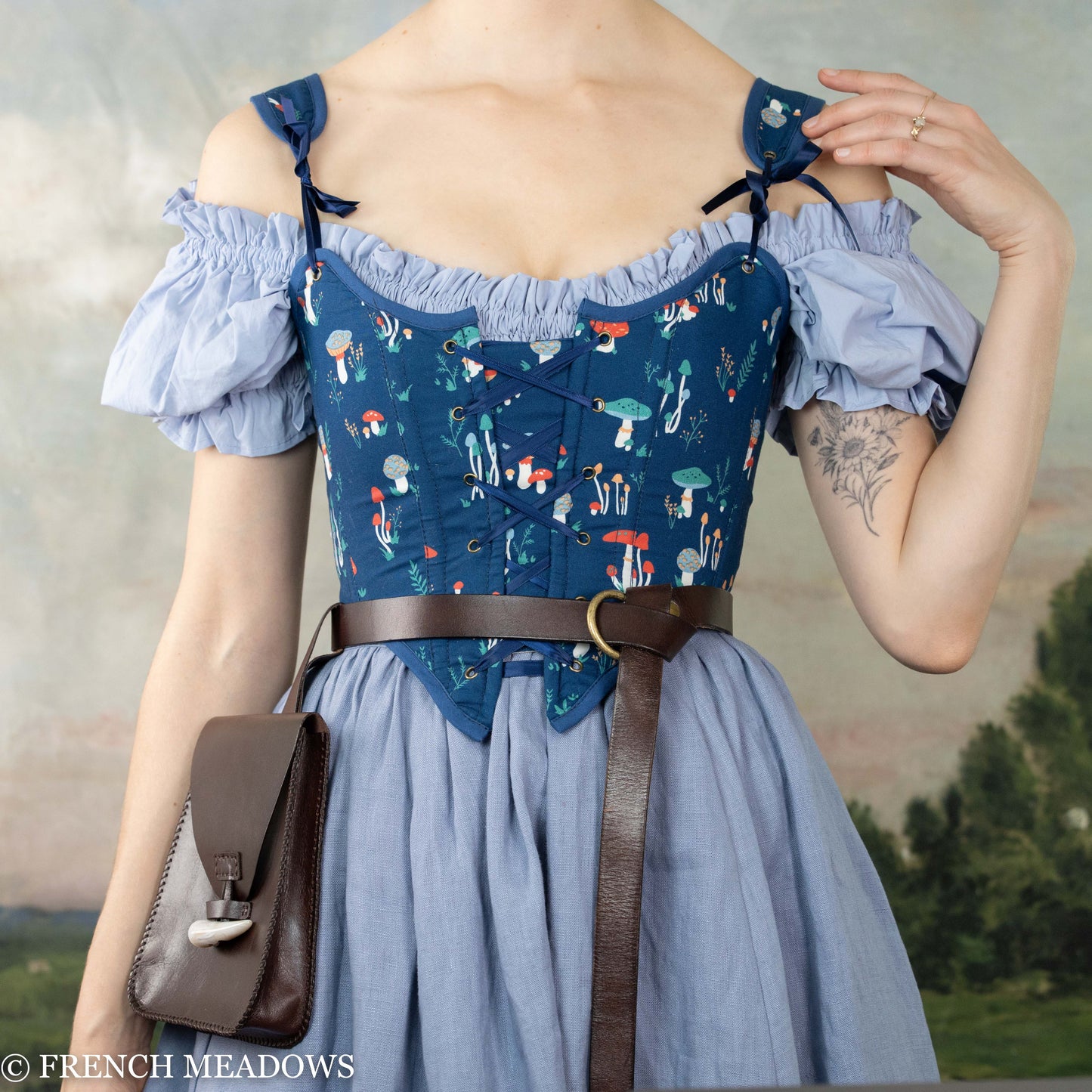 Blue Mushroom Renaissance Bodice featuring whimsical mushroom print, off-shoulder design, and blue cotton fabric with front lacing