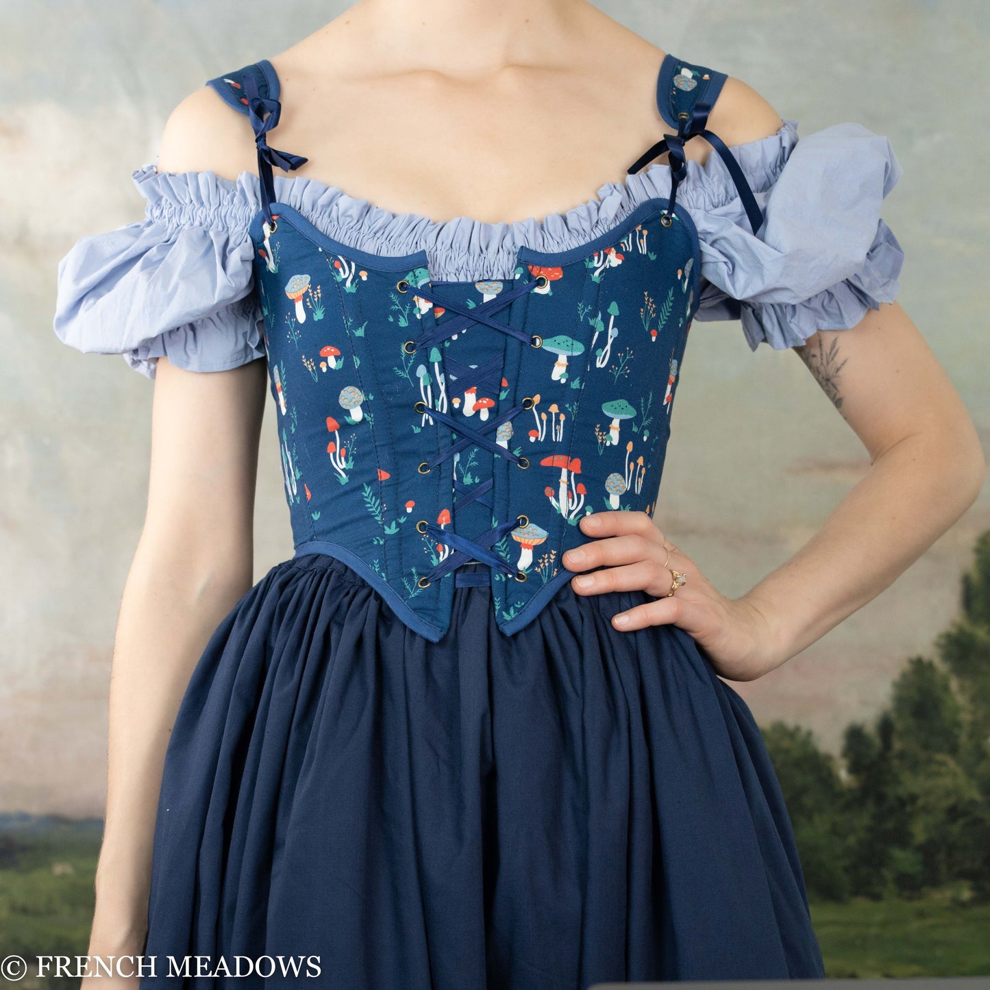 Blue Mushroom Renaissance Bodice featuring whimsical mushroom print, off-shoulder design with ruffled sleeves and lace-up front