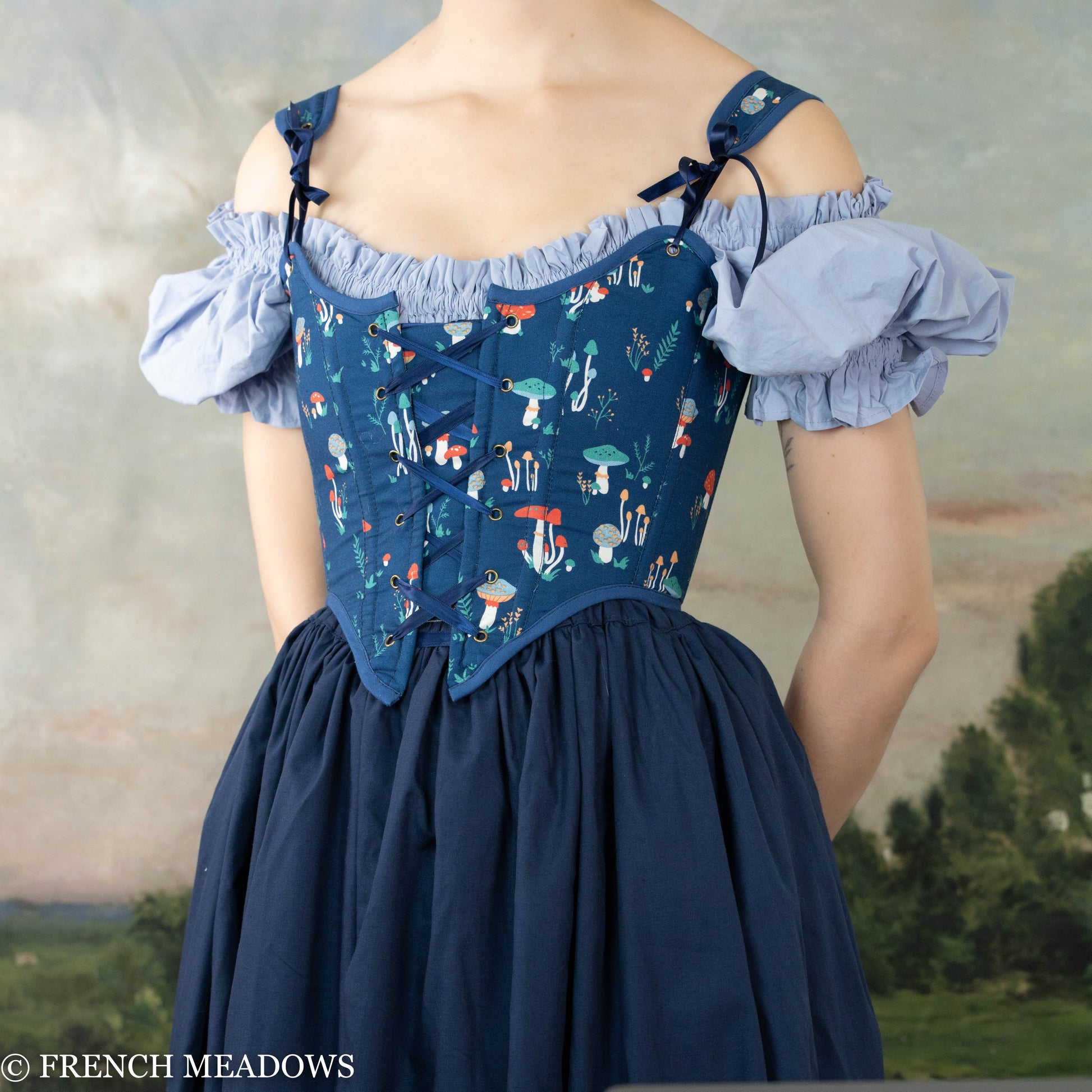 Blue Mushroom Renaissance Bodice featuring whimsical mushroom print, off-shoulder design with navy fabric and light blue puff sleeves