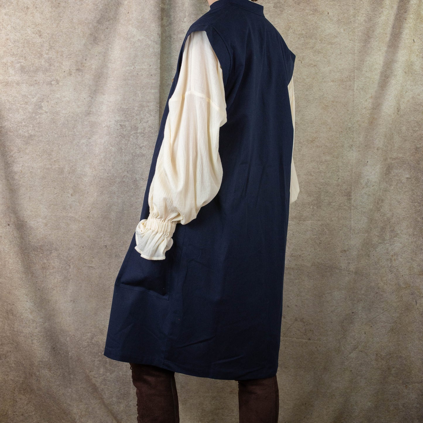 Navy Pirate Vest styled with cream renaissance shirt, showing side view of historical costume design for renaissance faires