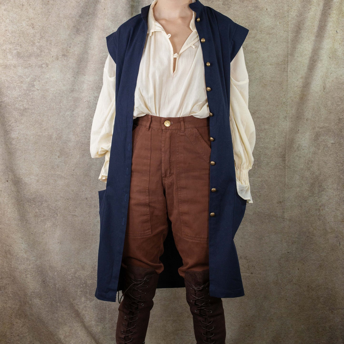 Navy Pirate Vest styled with cream shirt, brown pants and boots, showcasing historical costume design perfect for renaissance fairs