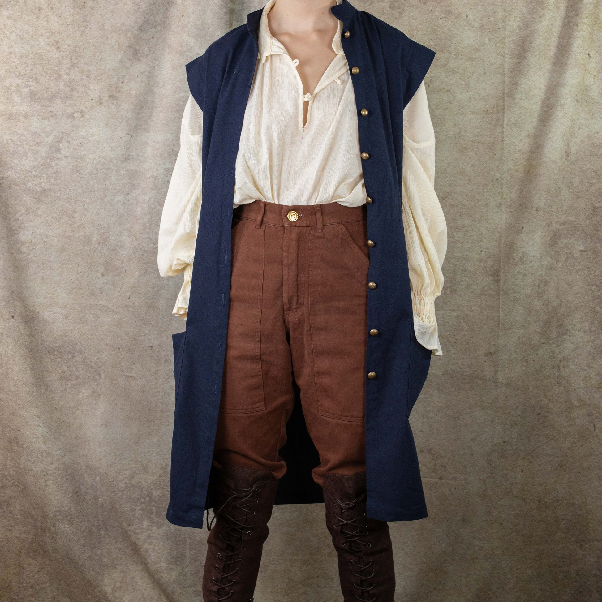 Navy Pirate Vest styled with cream shirt, brown pants and boots, showcasing historical costume design perfect for renaissance fairs