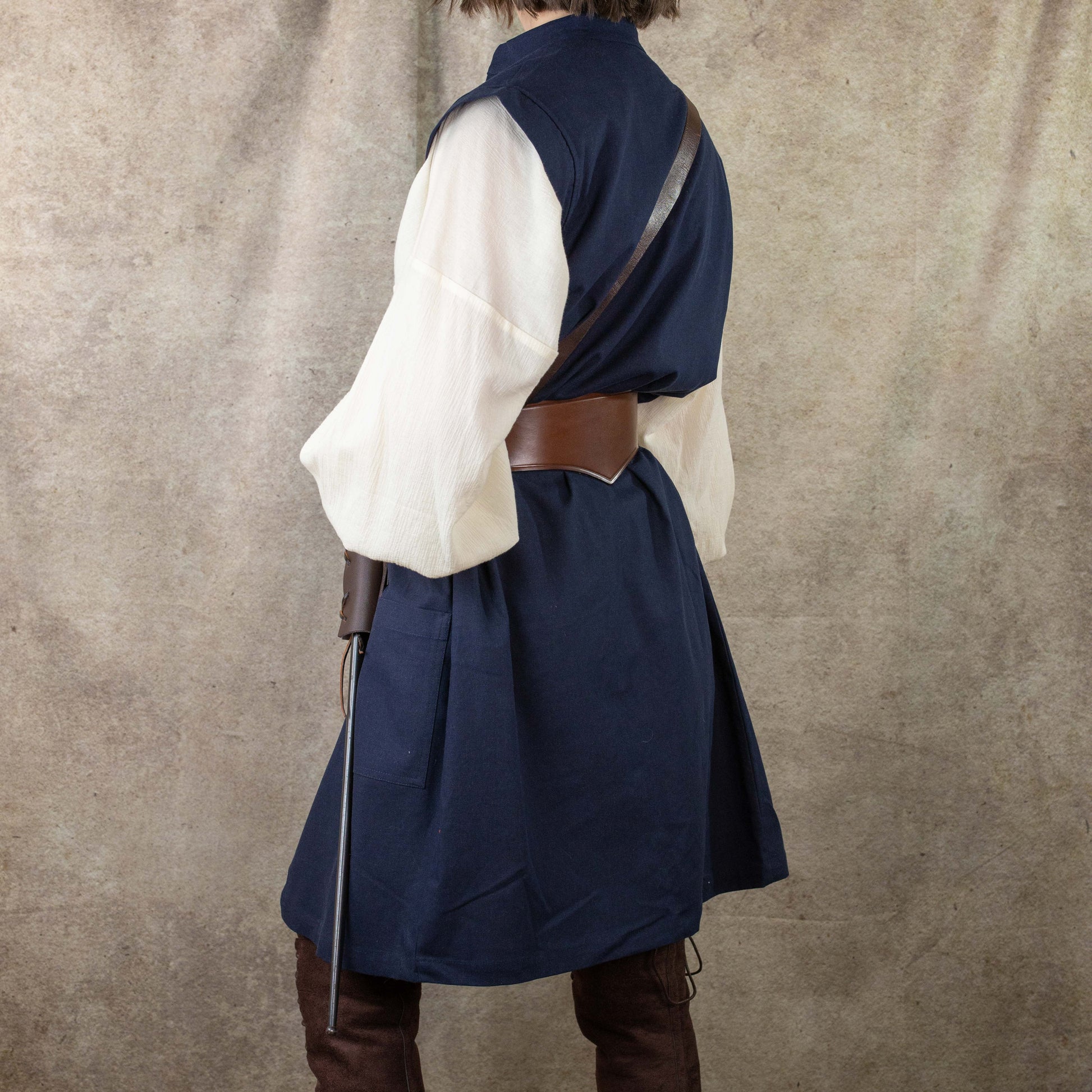 Navy Pirate Vest worn with white shirt and brown leather belt, shown from back view in renaissance costume style