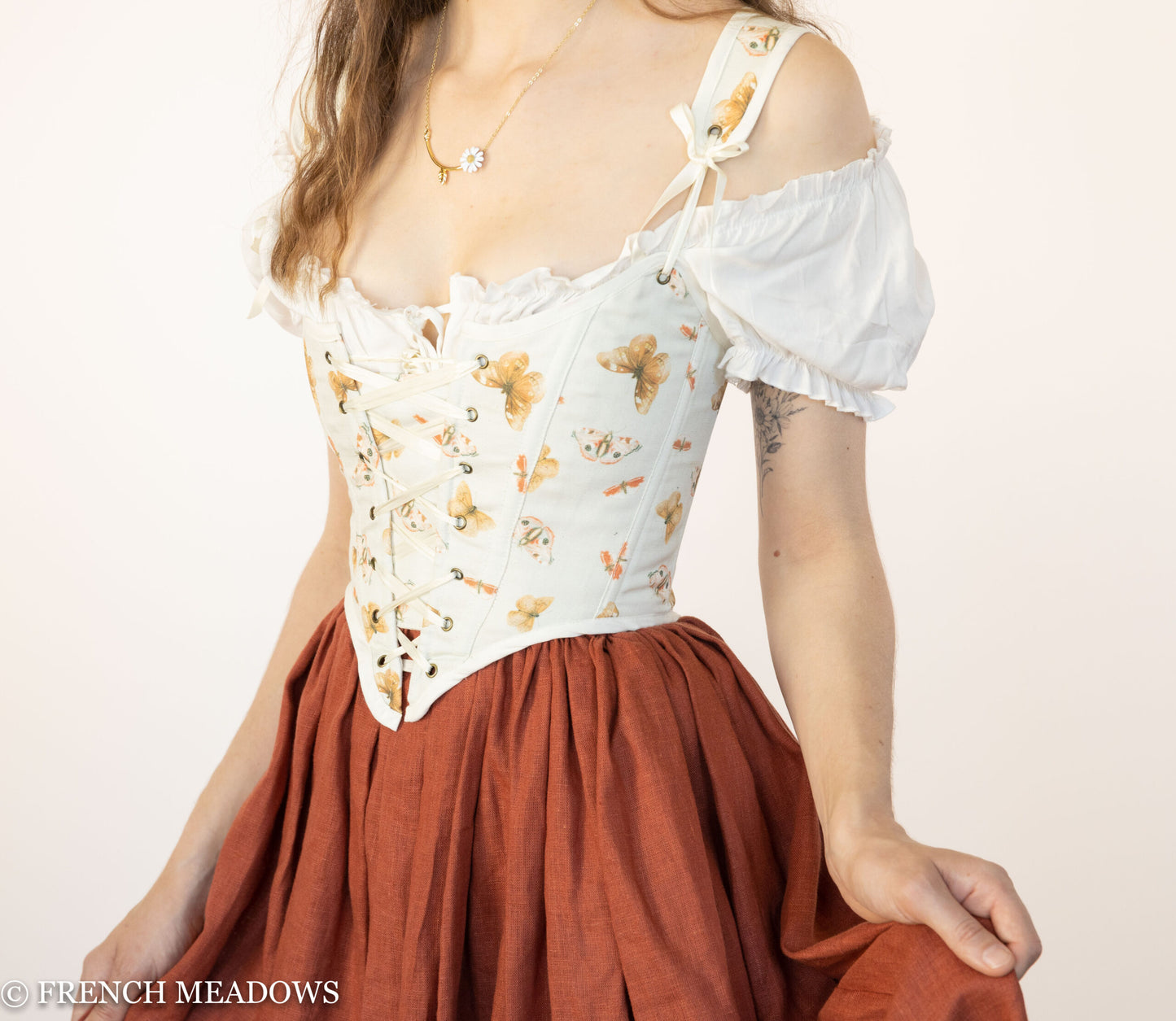 Handmade Butterfly Linen Renaissance Bodice with orange floral print on ivory, paired with rust-colored gathered skirt and puff sleeves