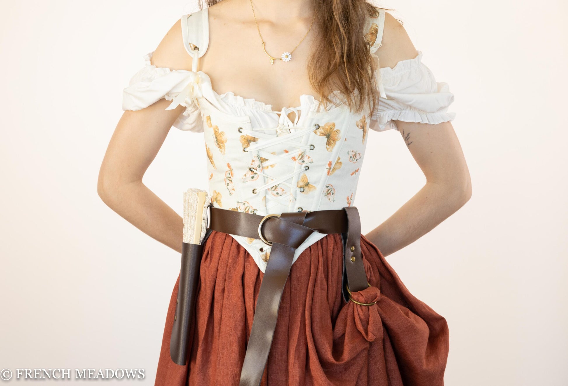 Handmade Butterfly Linen Renaissance Bodice with orange and ivory print, puffy sleeves, lace-up front, worn with rust skirt
