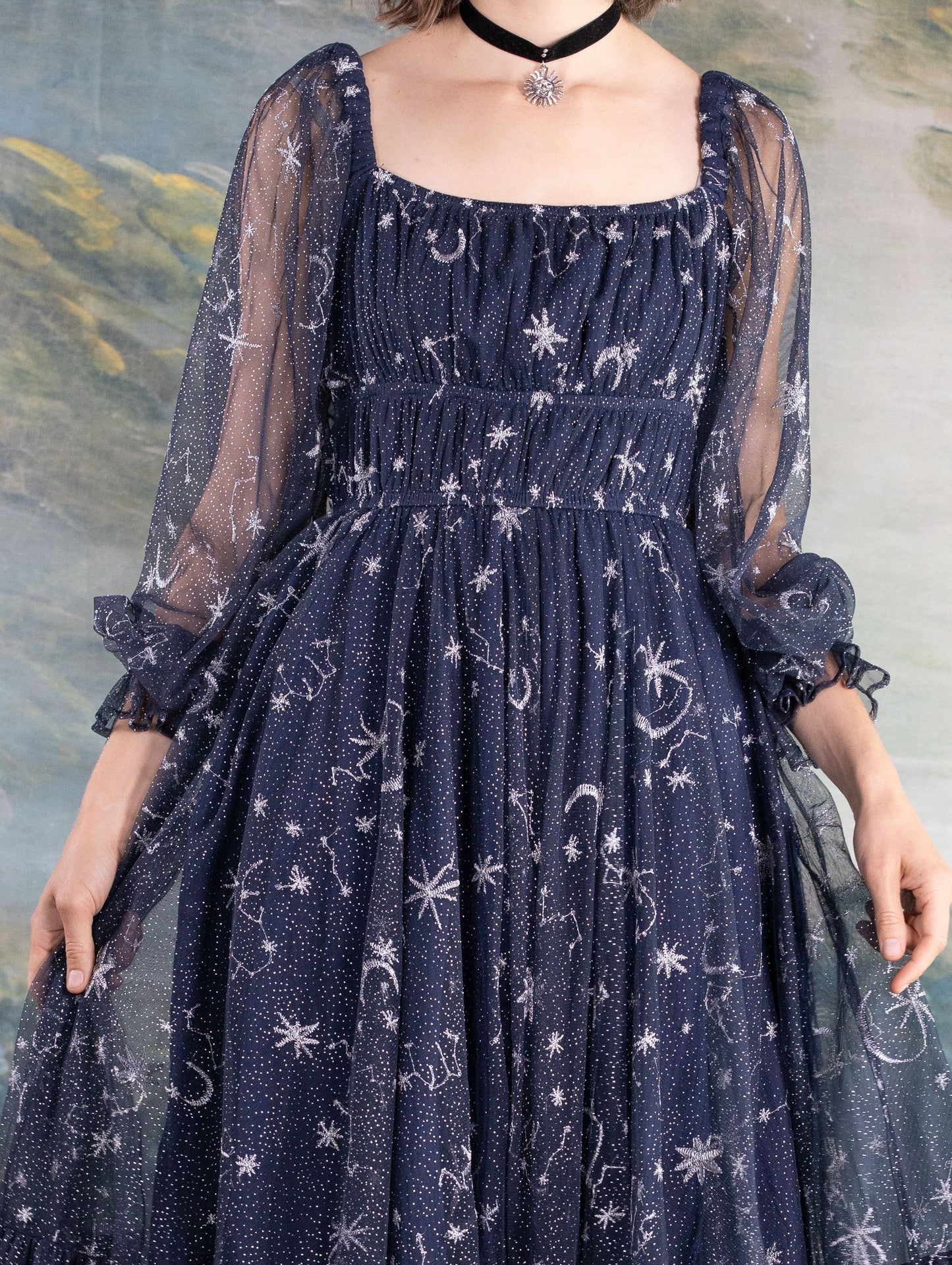 Navy blue Celestial Tulle Dress with sheer sleeves and starry celestial pattern for an enchanting look.