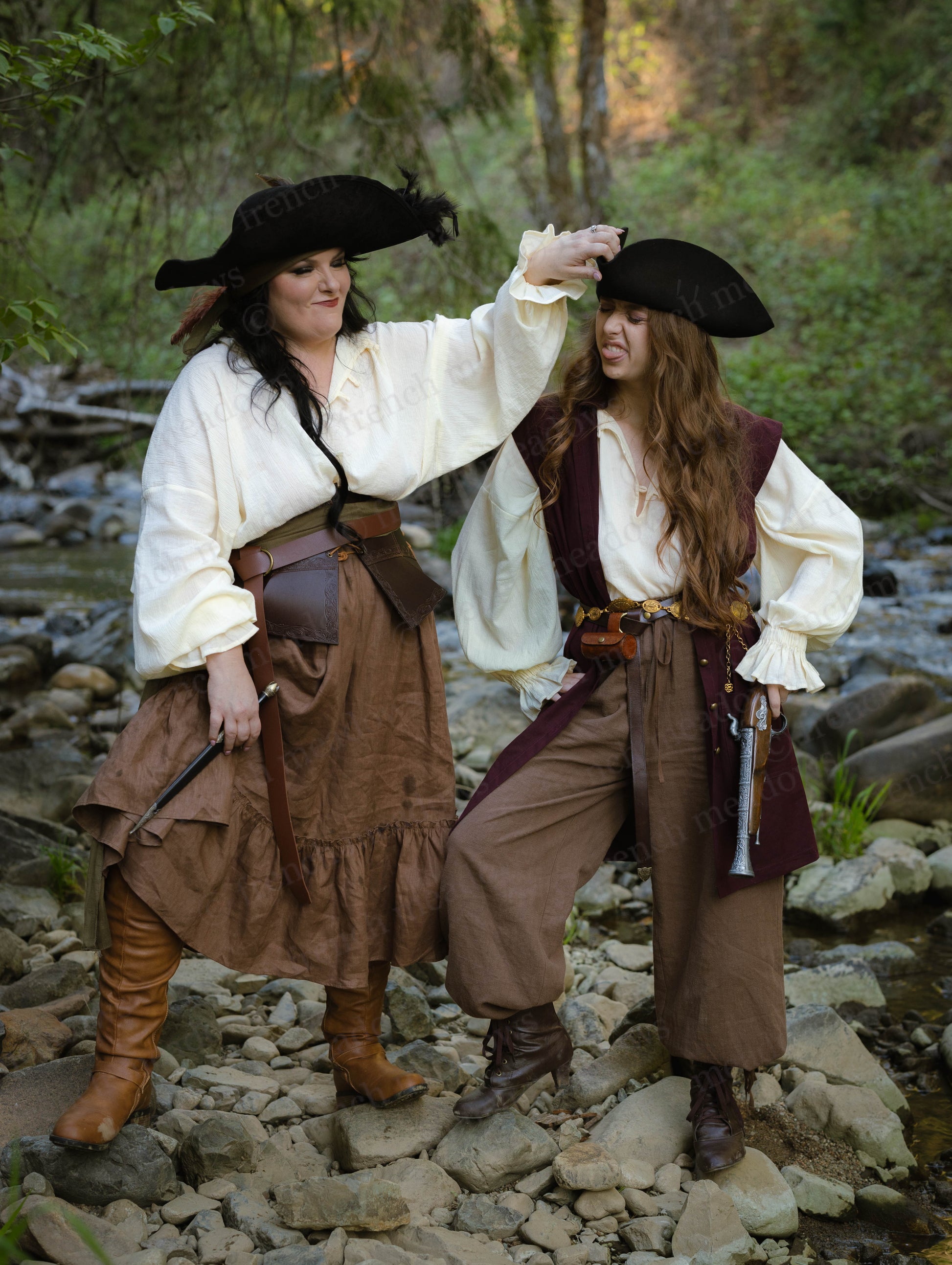 Brown Linen Ruffle Skirt shown in renaissance costume with white chemise, leather accessories and tricorn hat by creek
