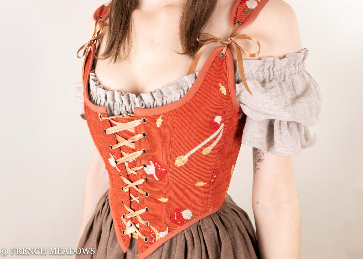 Handmade embroidered mushroom renaissance bodice in burnt orange corduroy with lace-up front and ruffled gray sleeves
