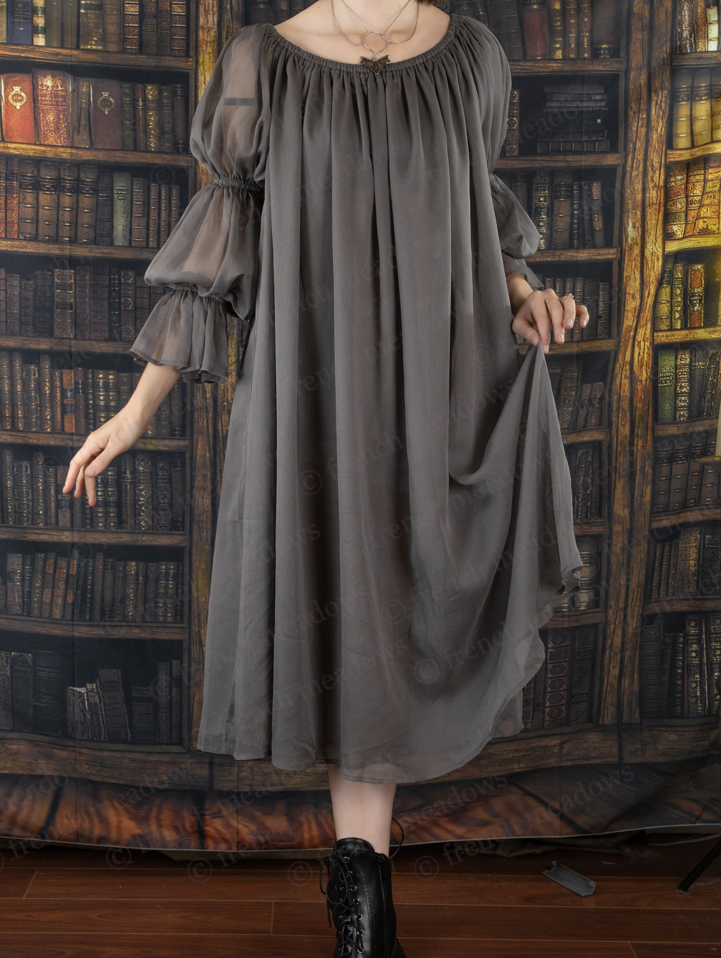 Grey Chiffon Chemise with flowing fabric and puff sleeves shown against vintage library backdrop, elegant Renaissance-style design