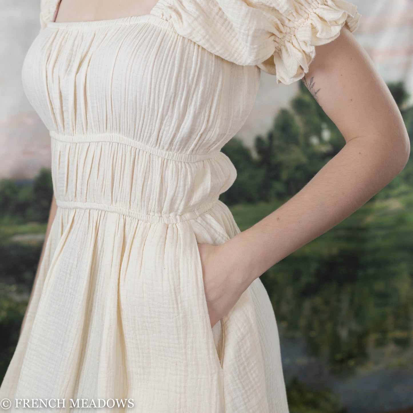 detail view of the white cotton renaissance chemise dress with pocks