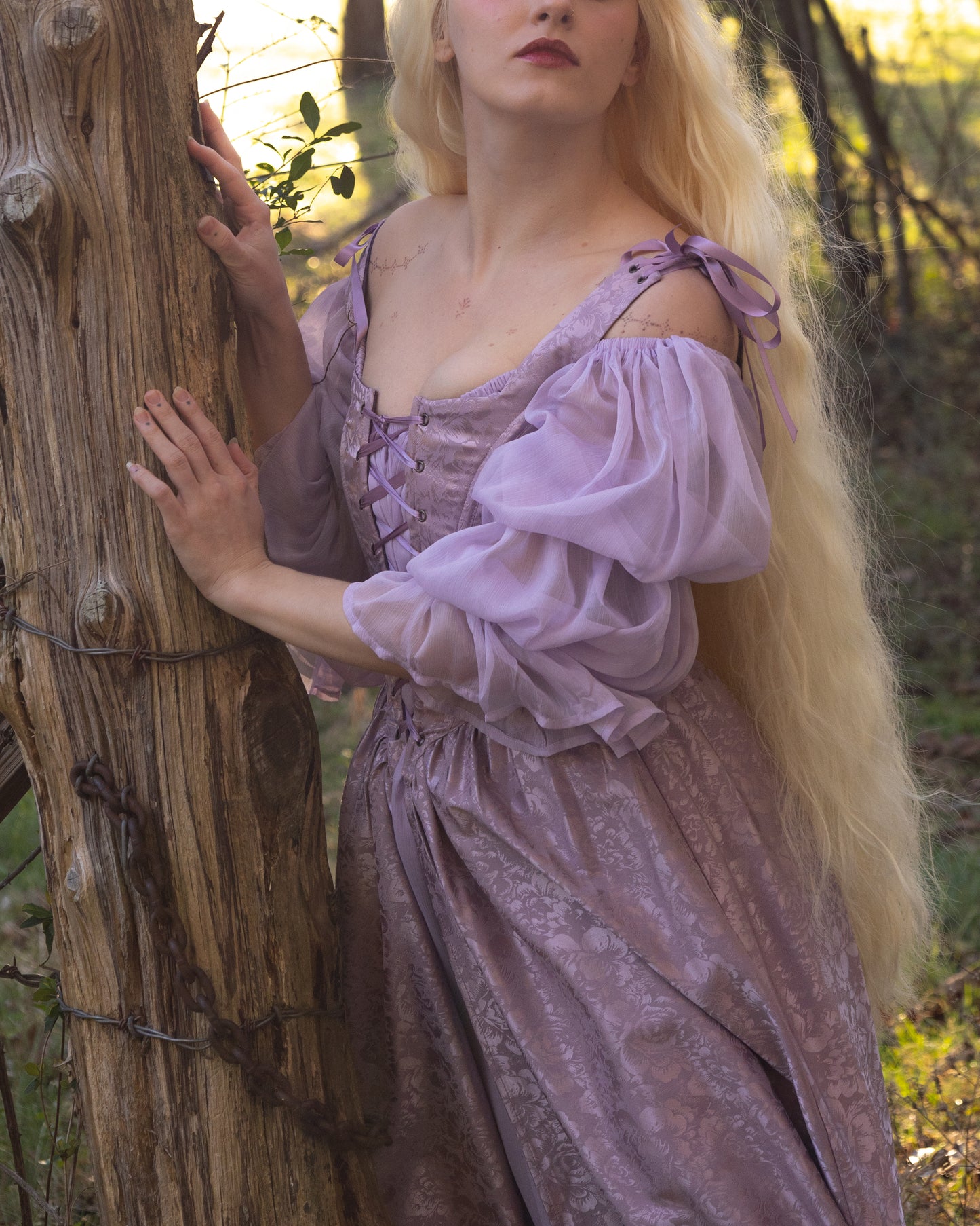 Lilac Chiffon Chemise with puff sleeves and flowing silhouette shown in enchanted forest setting at sunset against rustic tree trunk
