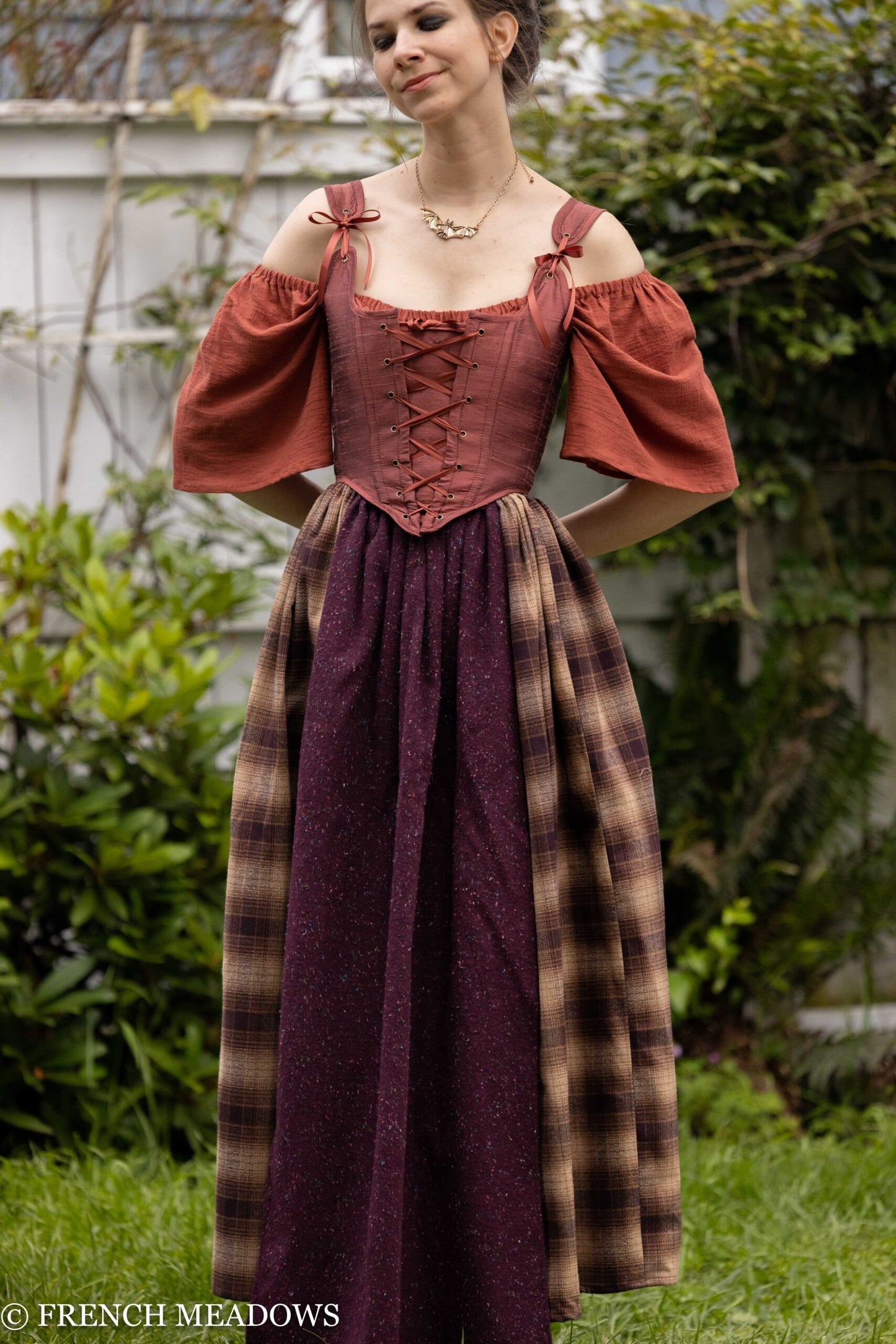 Mary Sanderson Skirt in brown plaid with purple apron overlay, off-shoulder corset dress in vintage witch costume style