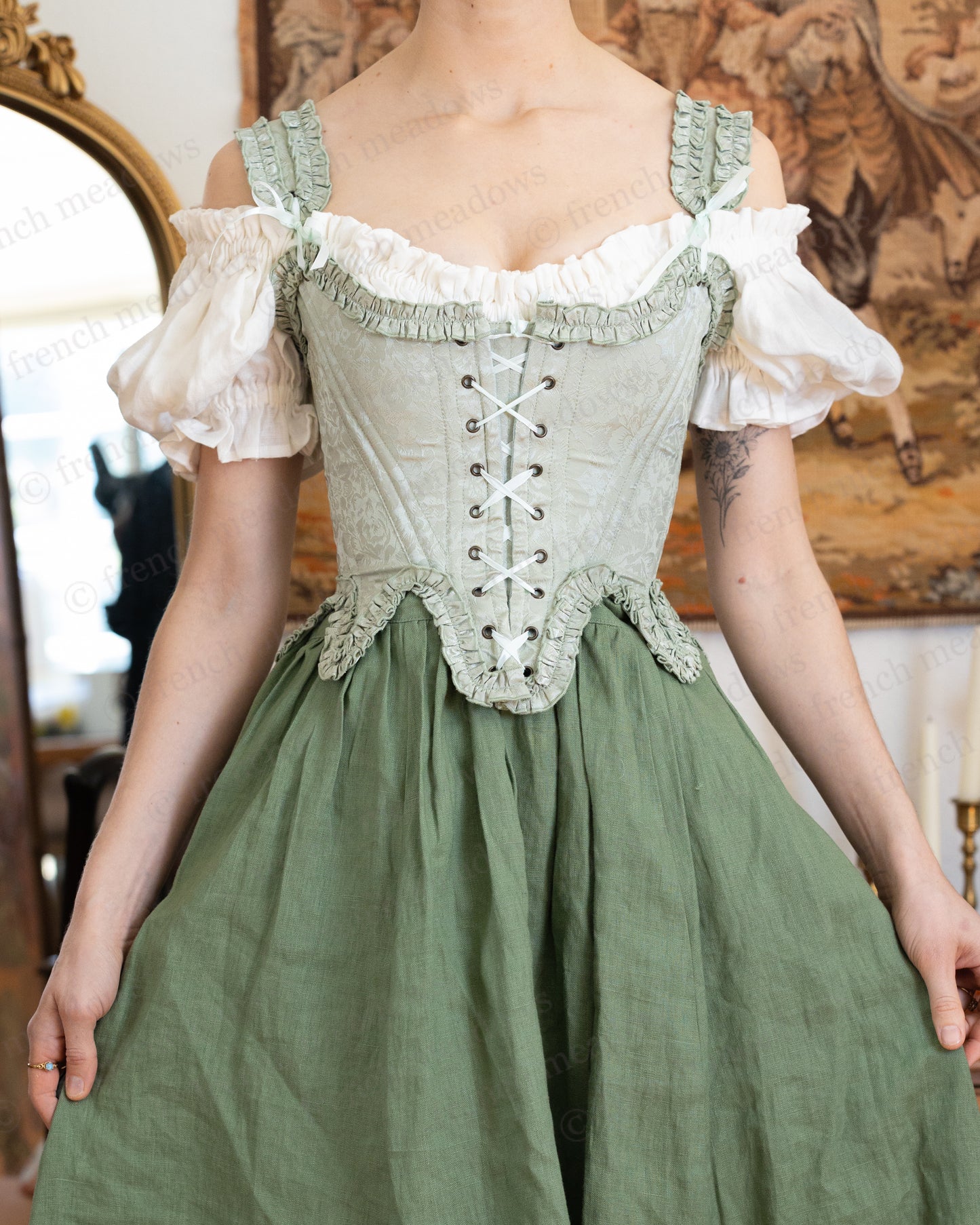 Ivory Short Sleeve Linen Chemise with off-shoulder ruffled neckline and puff sleeves under corset and skirt.