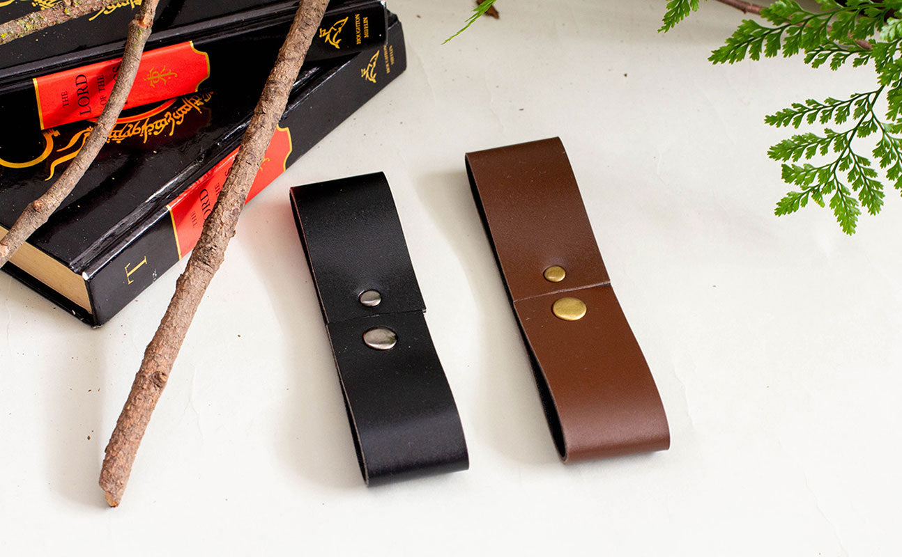 Vegan leather tankard strap in black and brown with metal snap closure for renaissance faire costumes and accessories