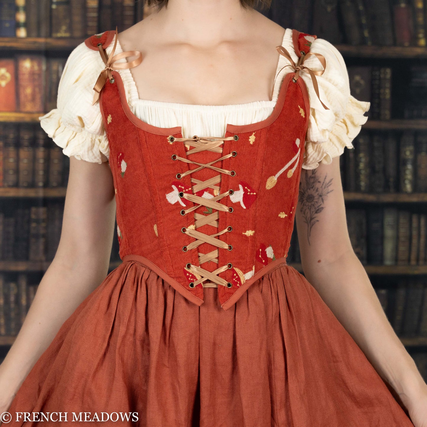 Handmade embroidered mushroom renaissance bodice in burnt orange corduroy with cream puff sleeves and lace-up front detailing