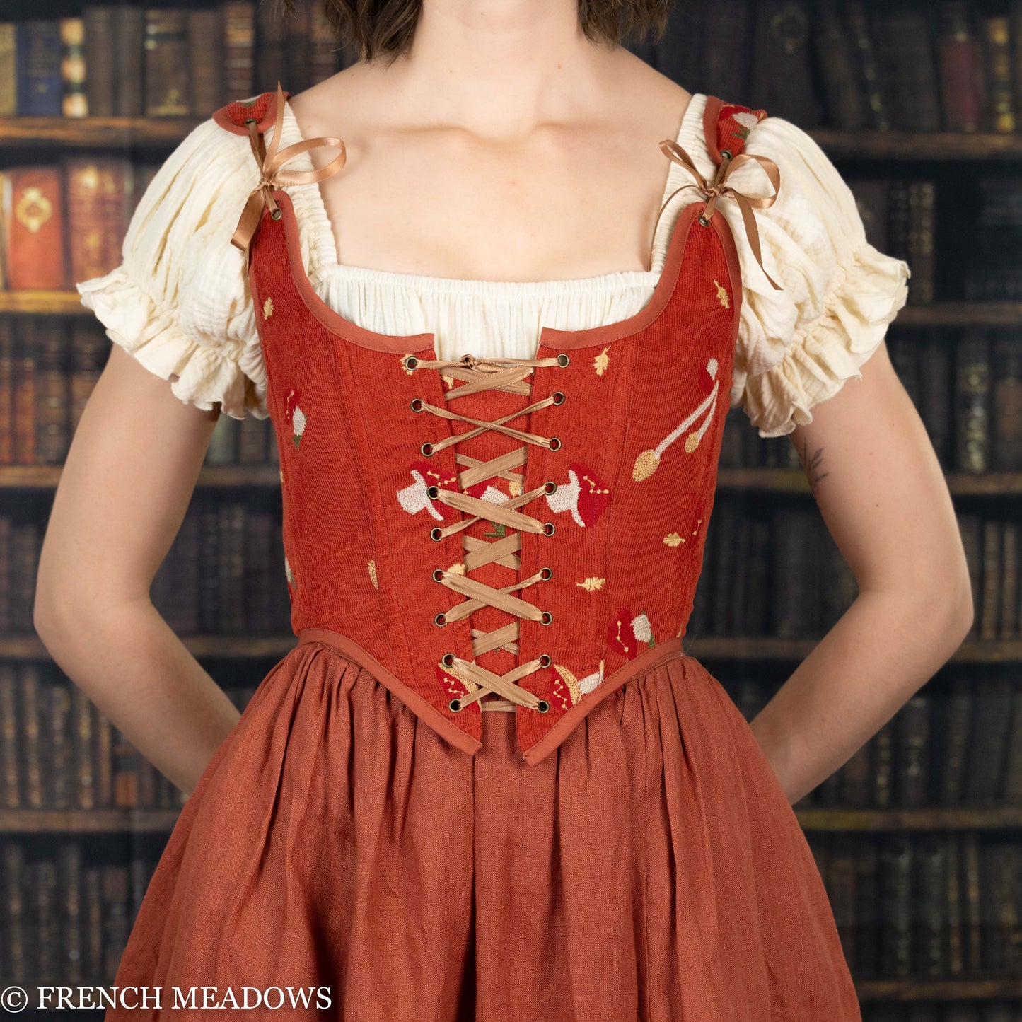 Handmade embroidered mushroom renaissance bodice in burnt orange corduroy with cream peasant sleeves and lace-up front detail