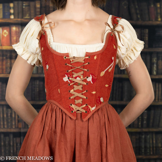 Handmade embroidered mushroom renaissance bodice in burnt orange corduroy with cream peasant sleeves and lace-up front detail