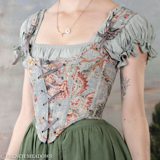 Handmade Parisian Blue Floral Renaissance Bodice with puffed sleeves, front lacing, and delicate floral print on light blue fabric