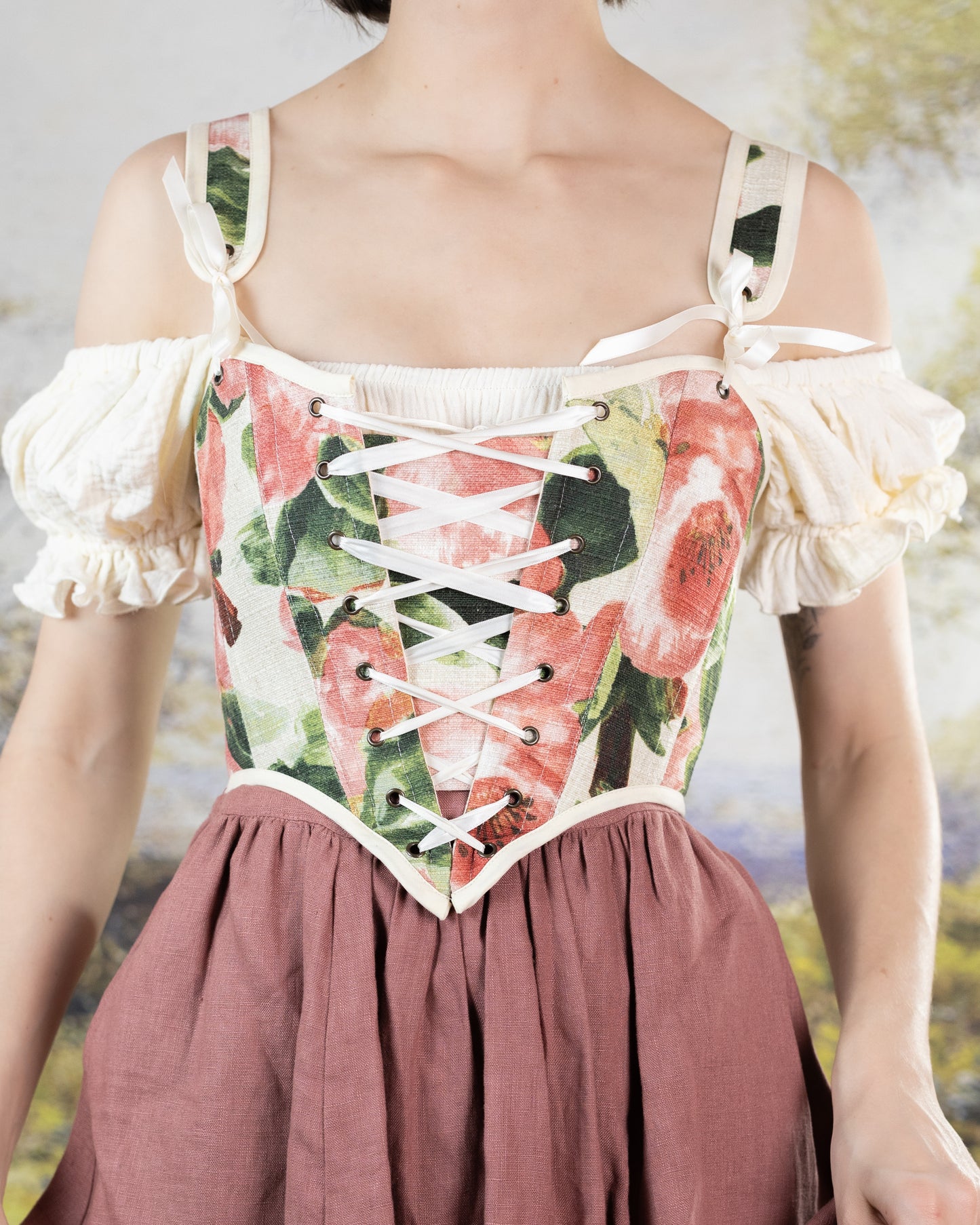 Ivory Cotton Milkmaid Dress with floral corset bodice, off-shoulder puff sleeves and dusty rose skirt