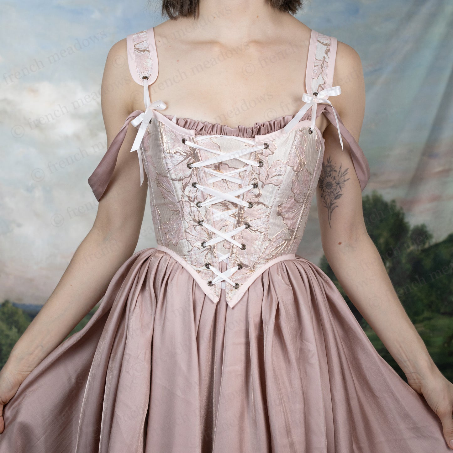 Pink and Gold Metallic Floral Corset Top with Renaissance-style lace-up front, sweetheart neckline, and gathered skirt in soft pink