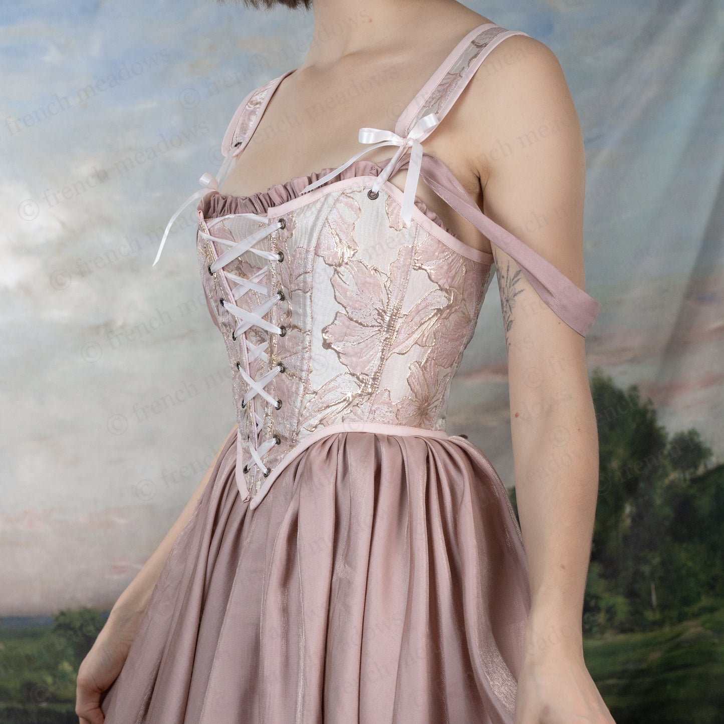 Pink and Gold Metallic Floral Corset Top with Renaissance-style bodice, lace-up front, and shimmering floral patterns on pink fabric