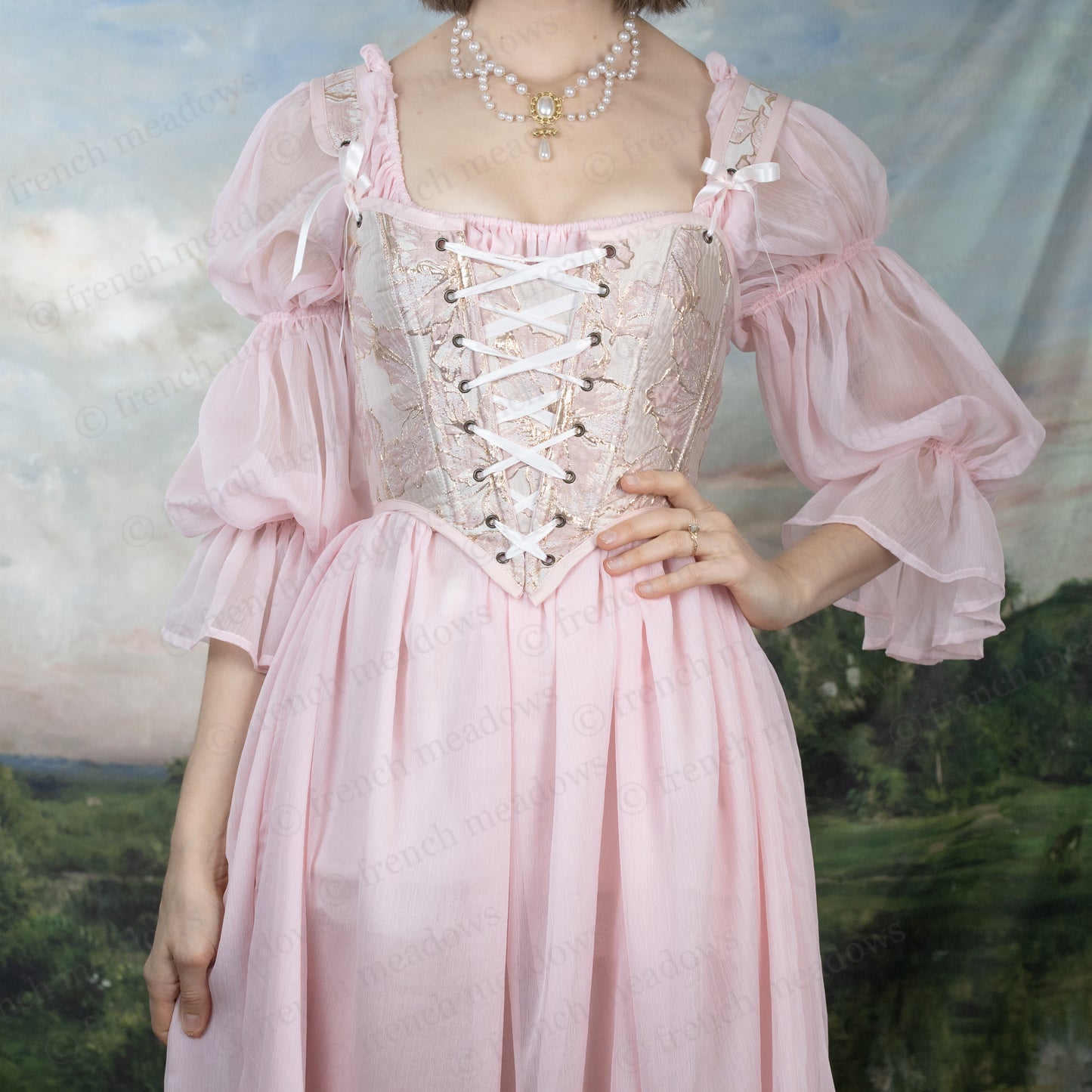 Pink and Gold Metallic Floral Corset Top with lace-up front, puffy sleeves and renaissance-style bodice in soft pink with gold accents