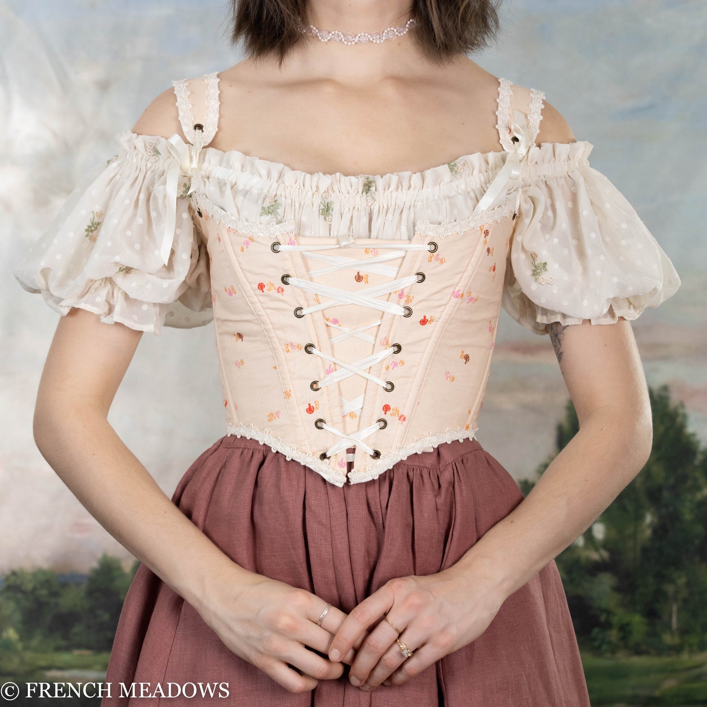 Handmade Ditsy Mushroom Renaissance Bodice with pink floral print, white puff sleeves, lace-up front, and crochet trim neckline