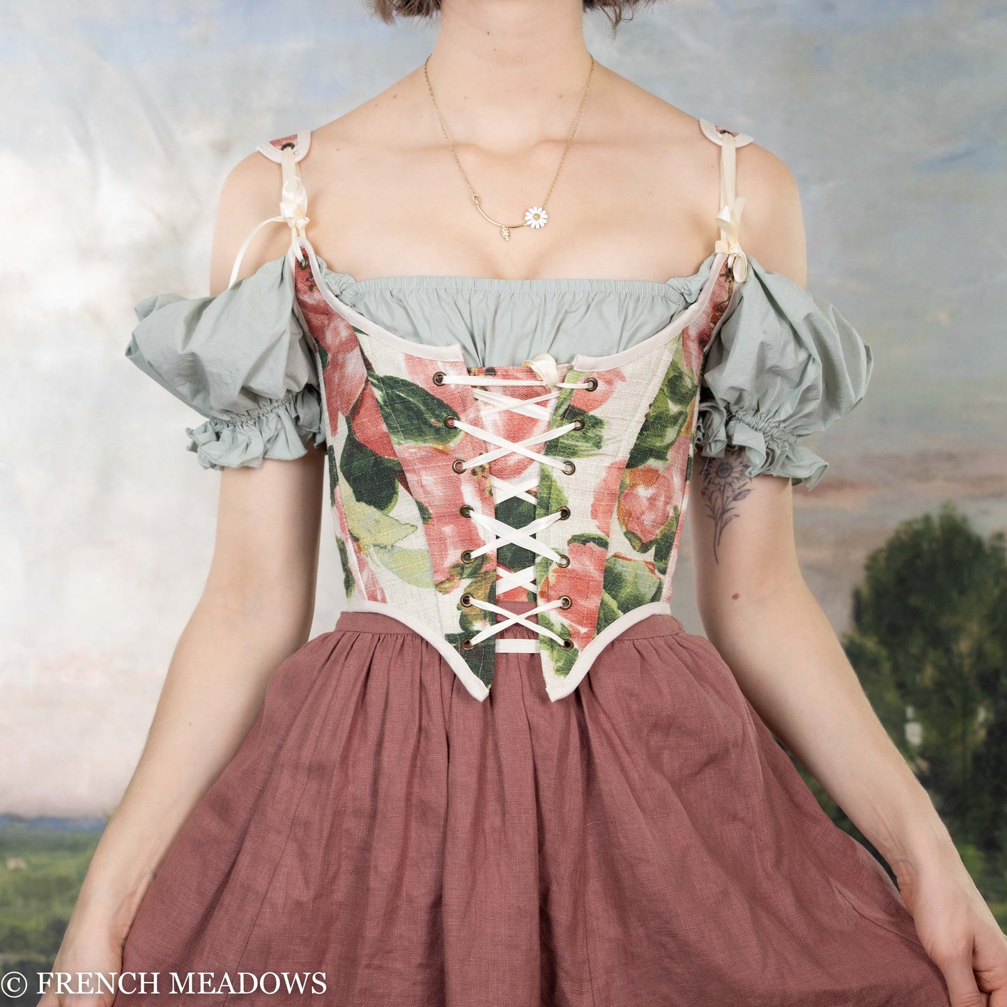 Pink Peony Renaissance Bodice with laced front, off-shoulder design, floral print on white background, and sage green puff sleeves