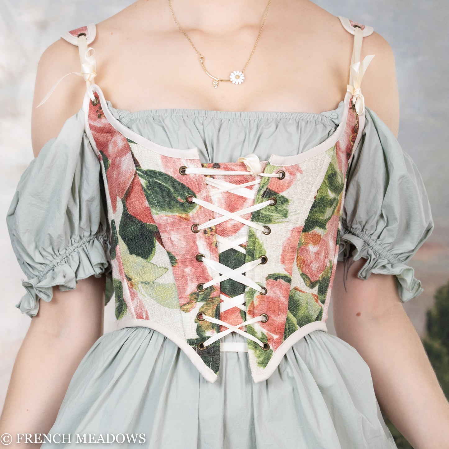 Handmade Pink Peony Renaissance Bodice featuring watercolor floral print, lace-up front, and puff sleeves in sage green and cream