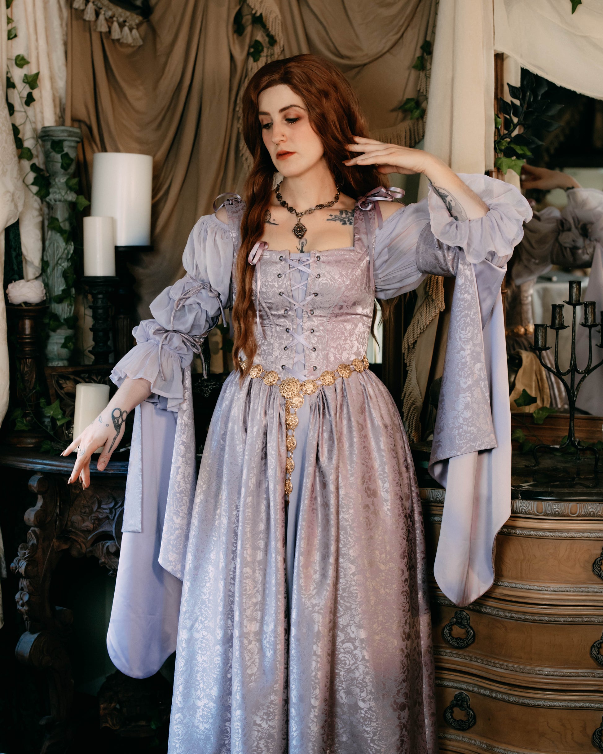 Lavender floral satin corset dress with laced bodice, square neckline, and flowing detachable sleeves in romantic medieval style