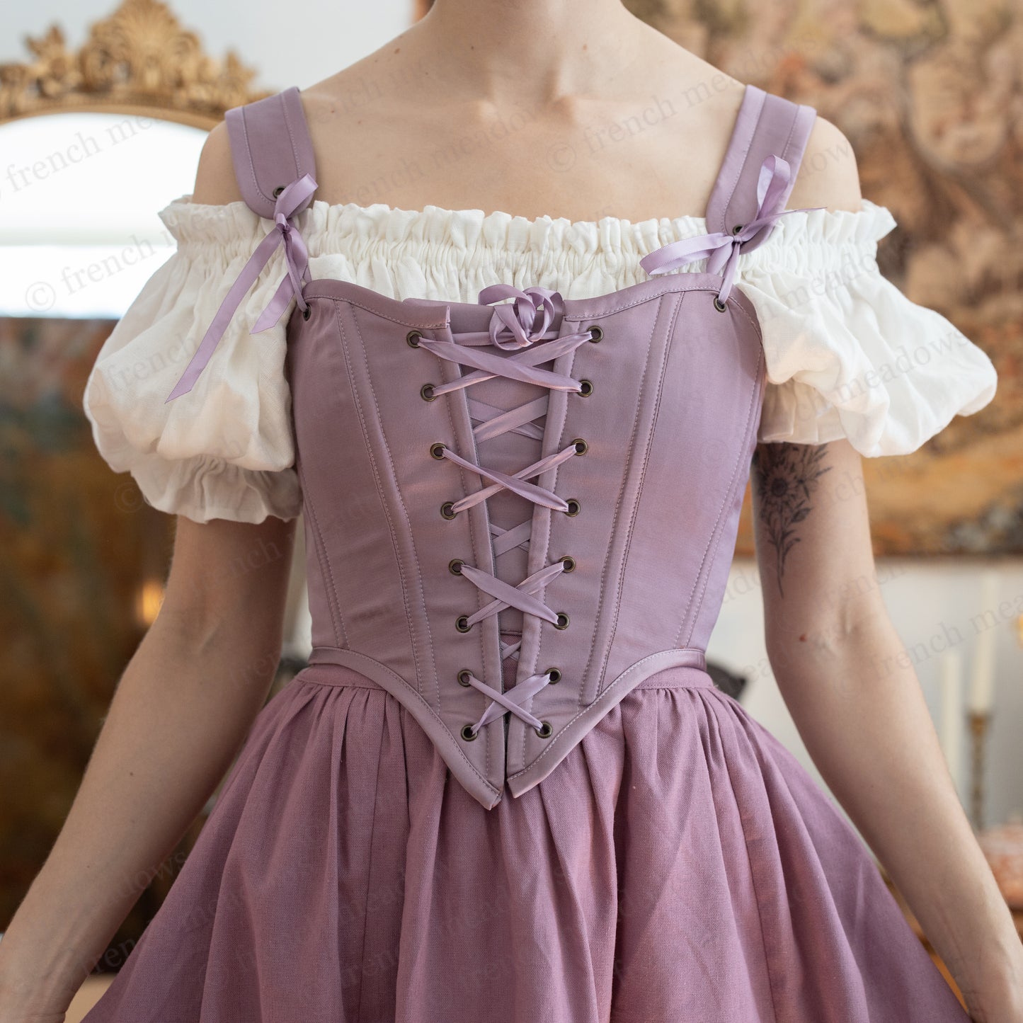 Purple Dusk Satin Corset Top with white puffy sleeves, lace-up front detail, and adjustable shoulder straps in a romantic style
