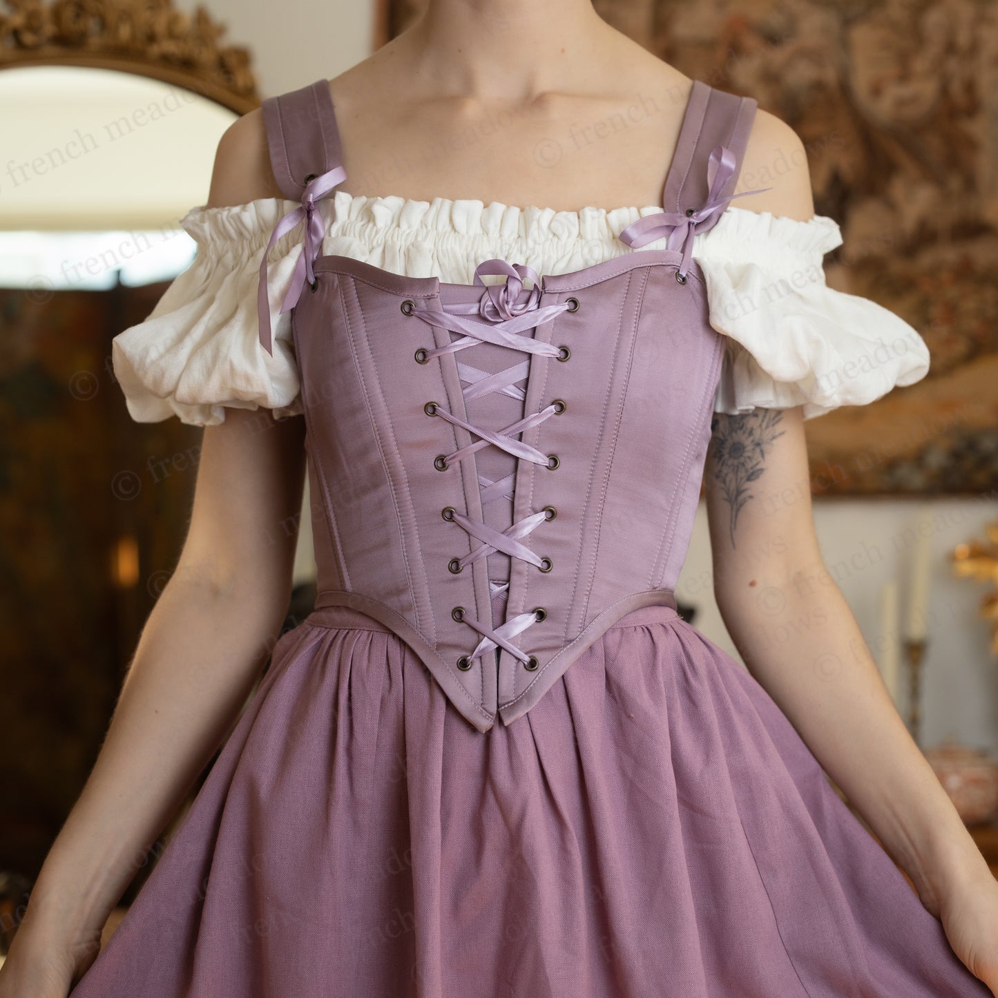 Ivory Short Sleeve Linen Chemise with ruffled elastic neckline and puff sleeves worn under a corset and skirt.