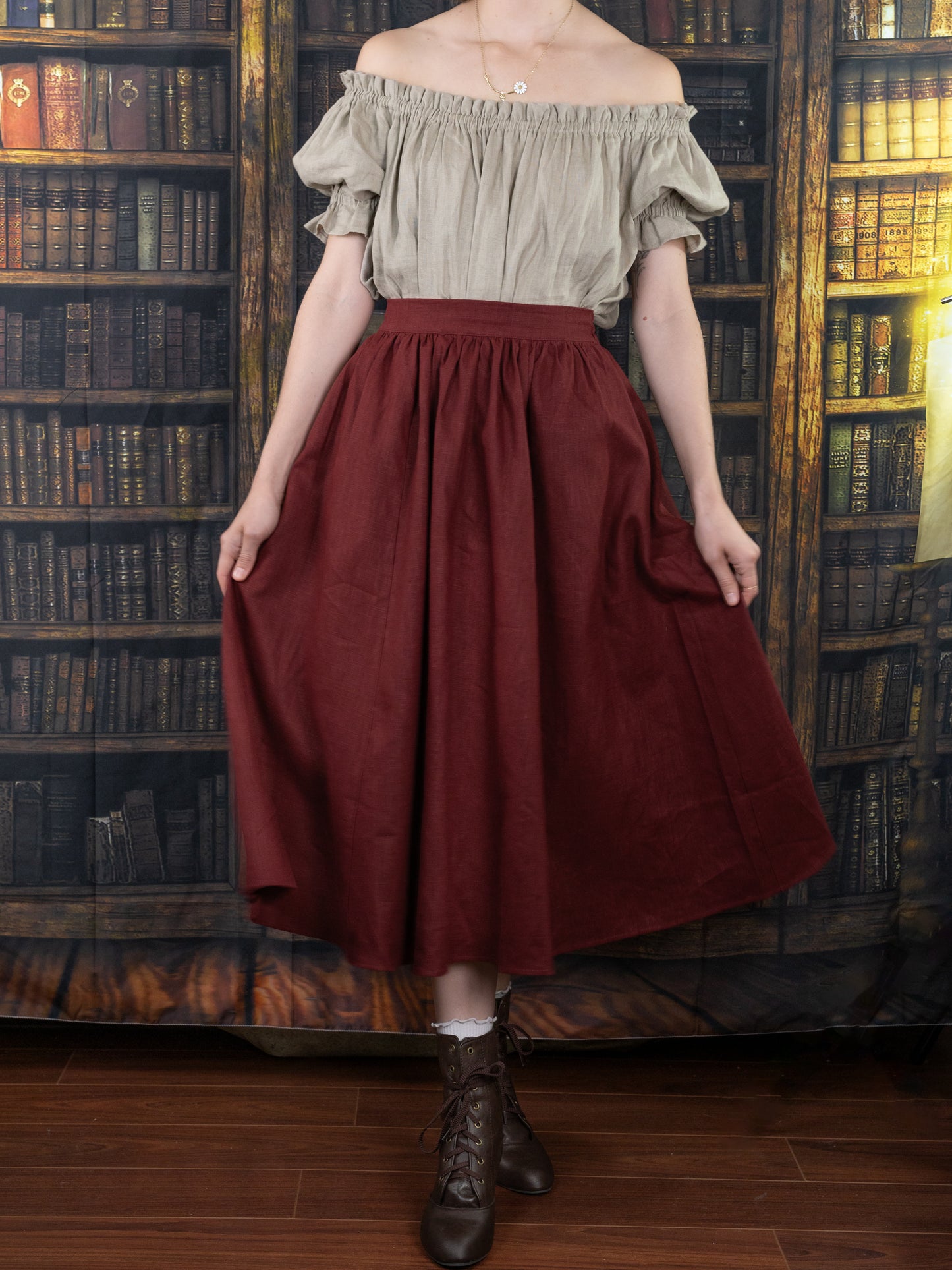 Burgundy Ramie Midi Skirt shown with off-shoulder beige top in library setting, styled for renaissance-inspired cottagecore look