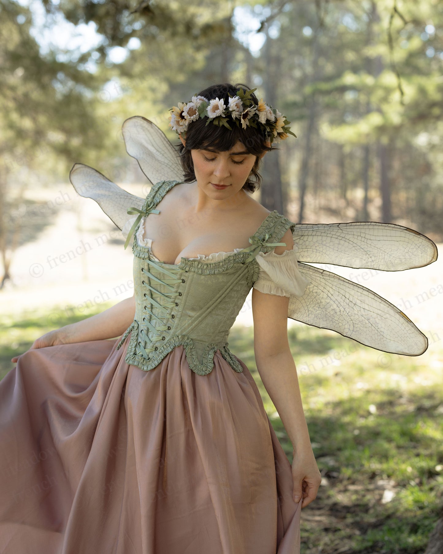 Mint Green Floral 18th Century Stays worn with fairy wings and floral crown in a forest setting.