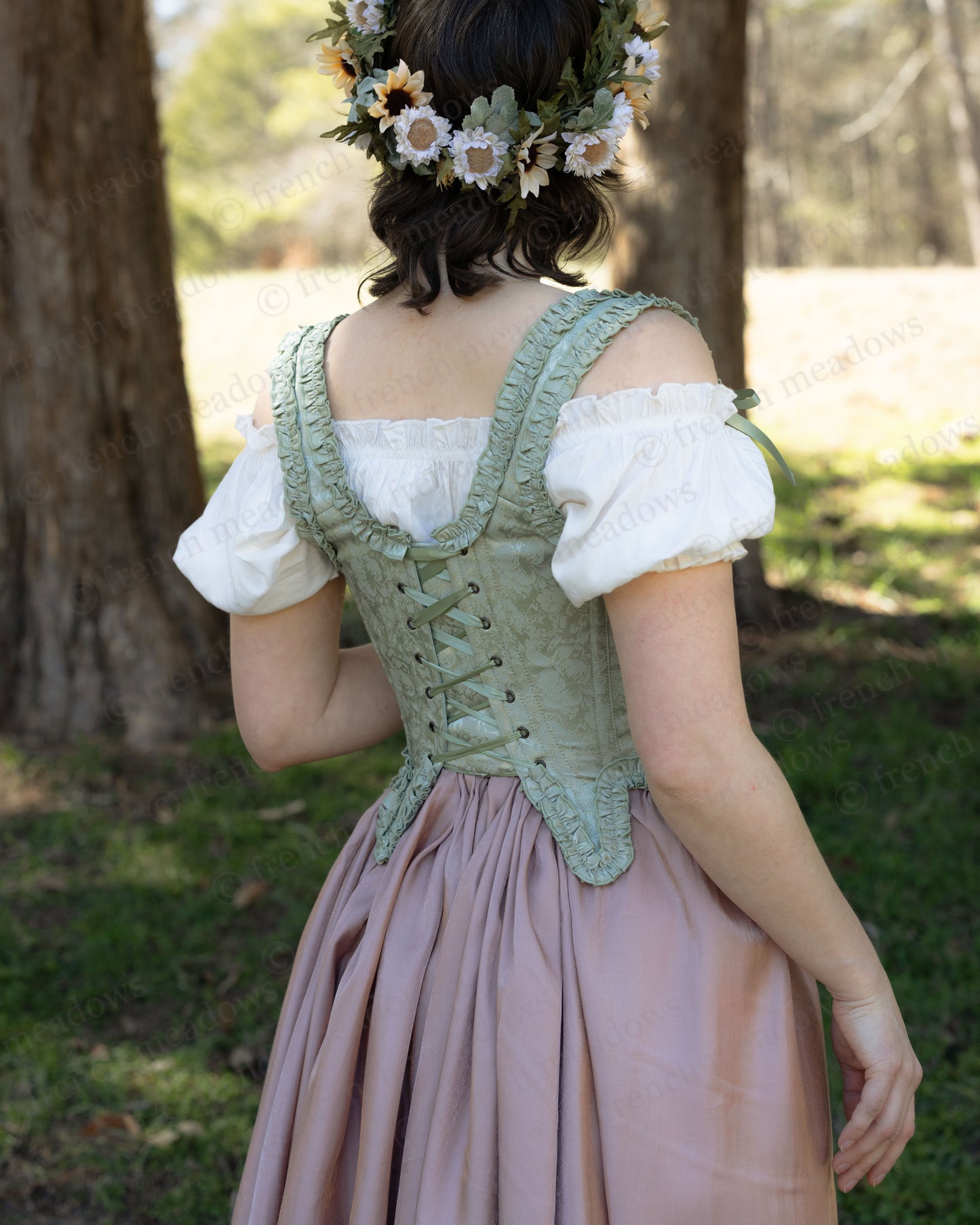 Mint Green Floral 18th Century Stays with ruffle details, front and back lacing, worn with white blouse and floral crown.