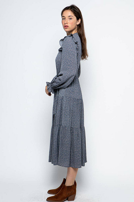 Ruffled Prairie Dress in blue floral print features tiered maxi design with smocked yoke, bishop sleeves and tie waist detail