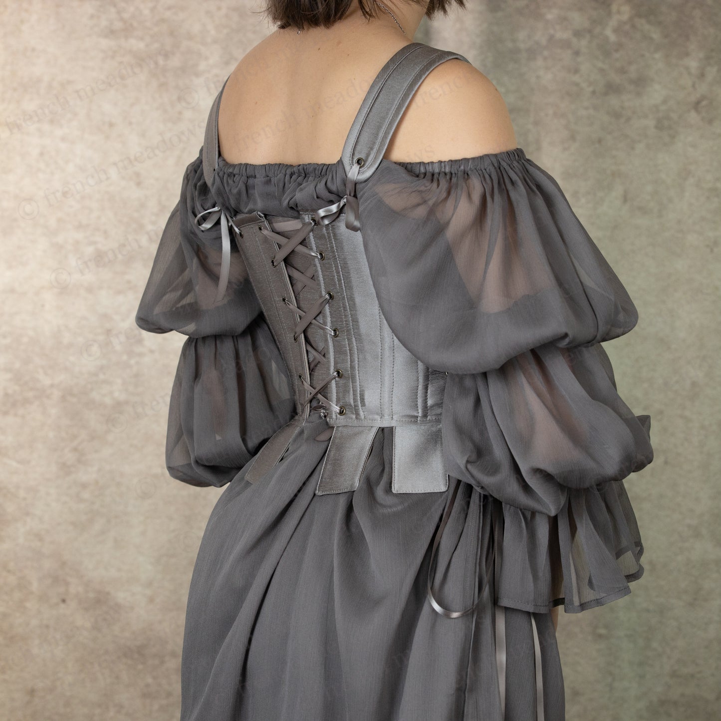 Silver Tabbed Tudor Stays shown from back with lacing detail and puffed sleeves in gray, showcasing ornamental square waist tabs