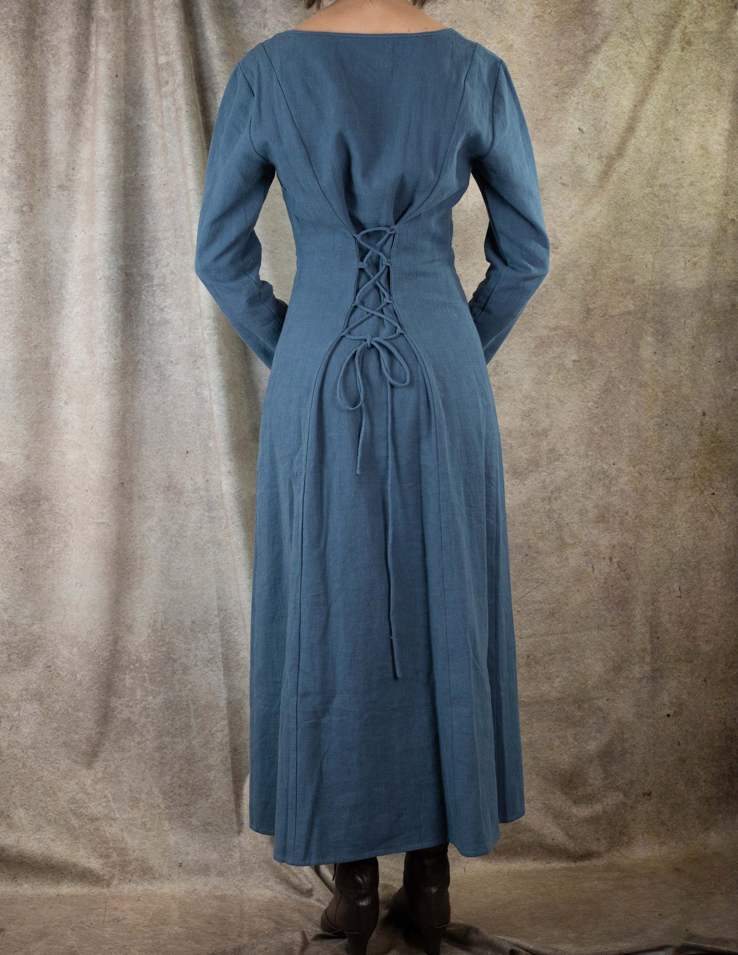 Teal Viking dress with back lacing detail, long sleeves and floor-length skirt shown from behind