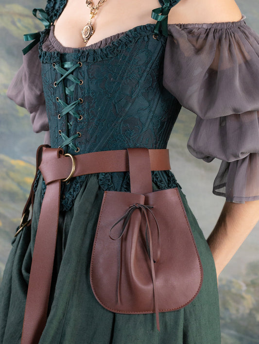 Brown vegan leather drawstring pouch attached to belt on renaissance costume with green dress and lace bodice