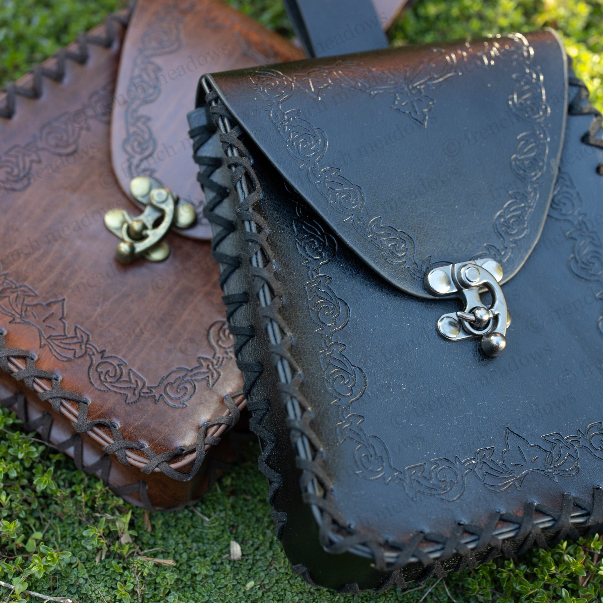 Elven Medieval Belt Pouch with embossed scroll design in black and brown leather, featuring decorative clasp and whipstitched edges