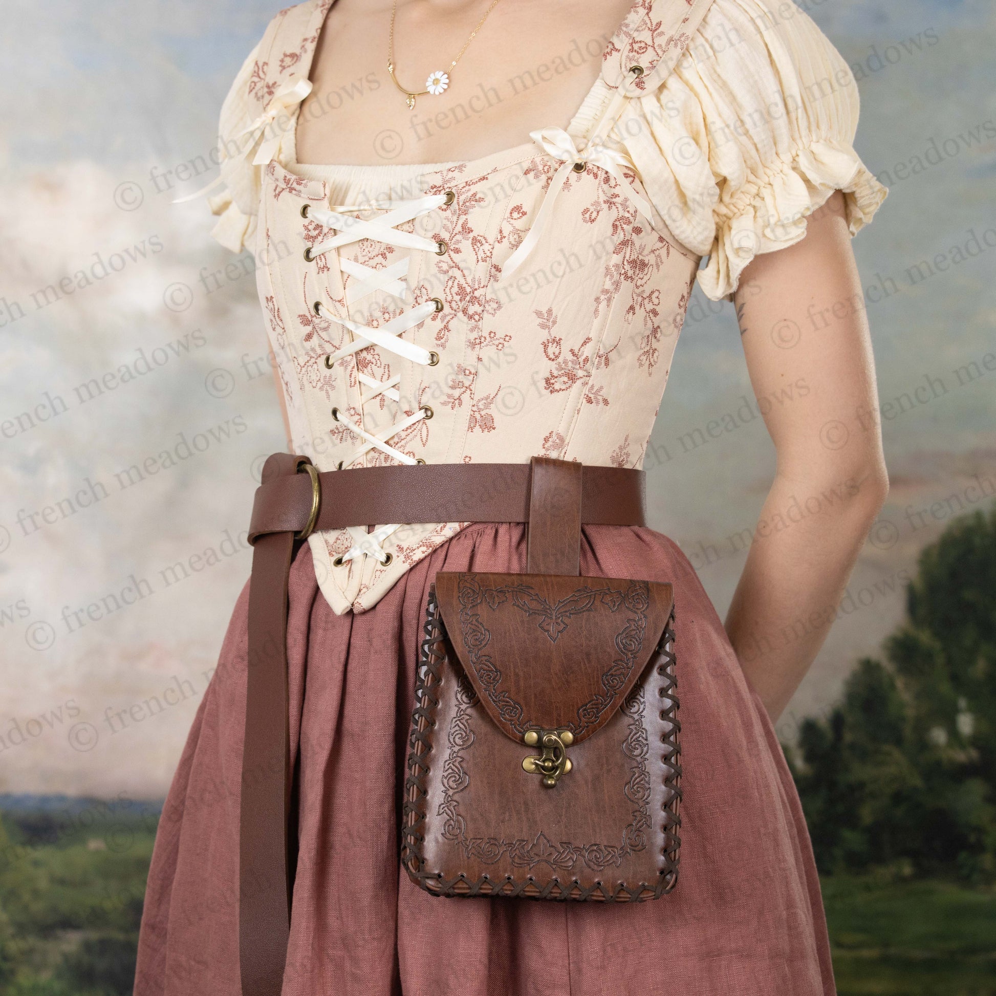 Elven Medieval Belt Pouch in brown leather with decorative scrollwork, attached to belt on medieval dress costume