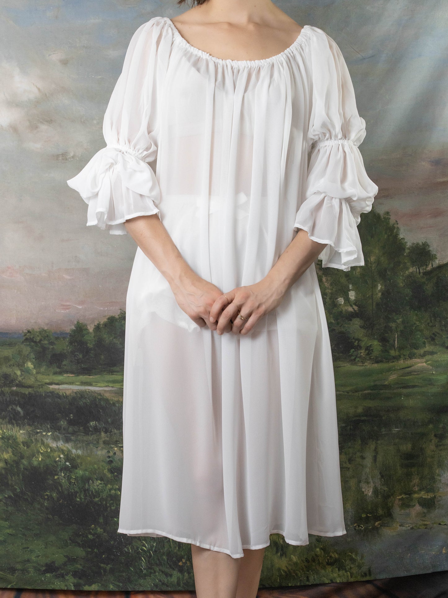 Soft White Chiffon Chemise with billowing sleeves and elastic neckline, shown against pastoral background