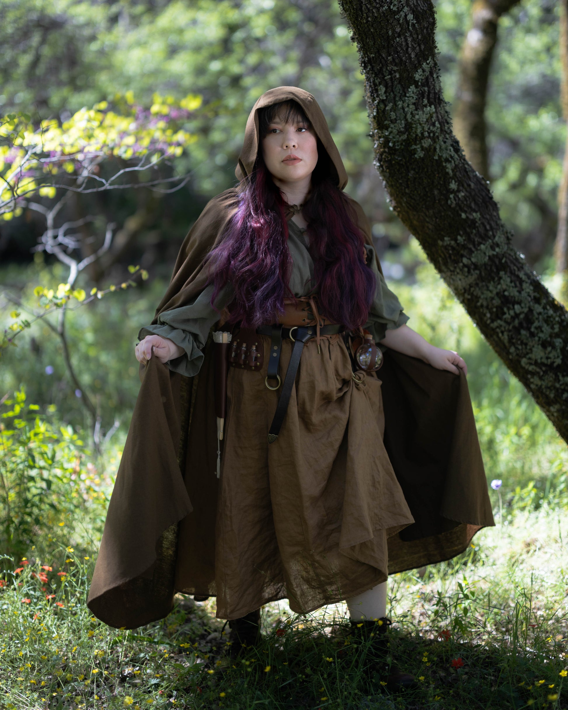 Woman in forest wearing brown Linen Renaissance Cloak with hood during daytime outdoors roleplay costume