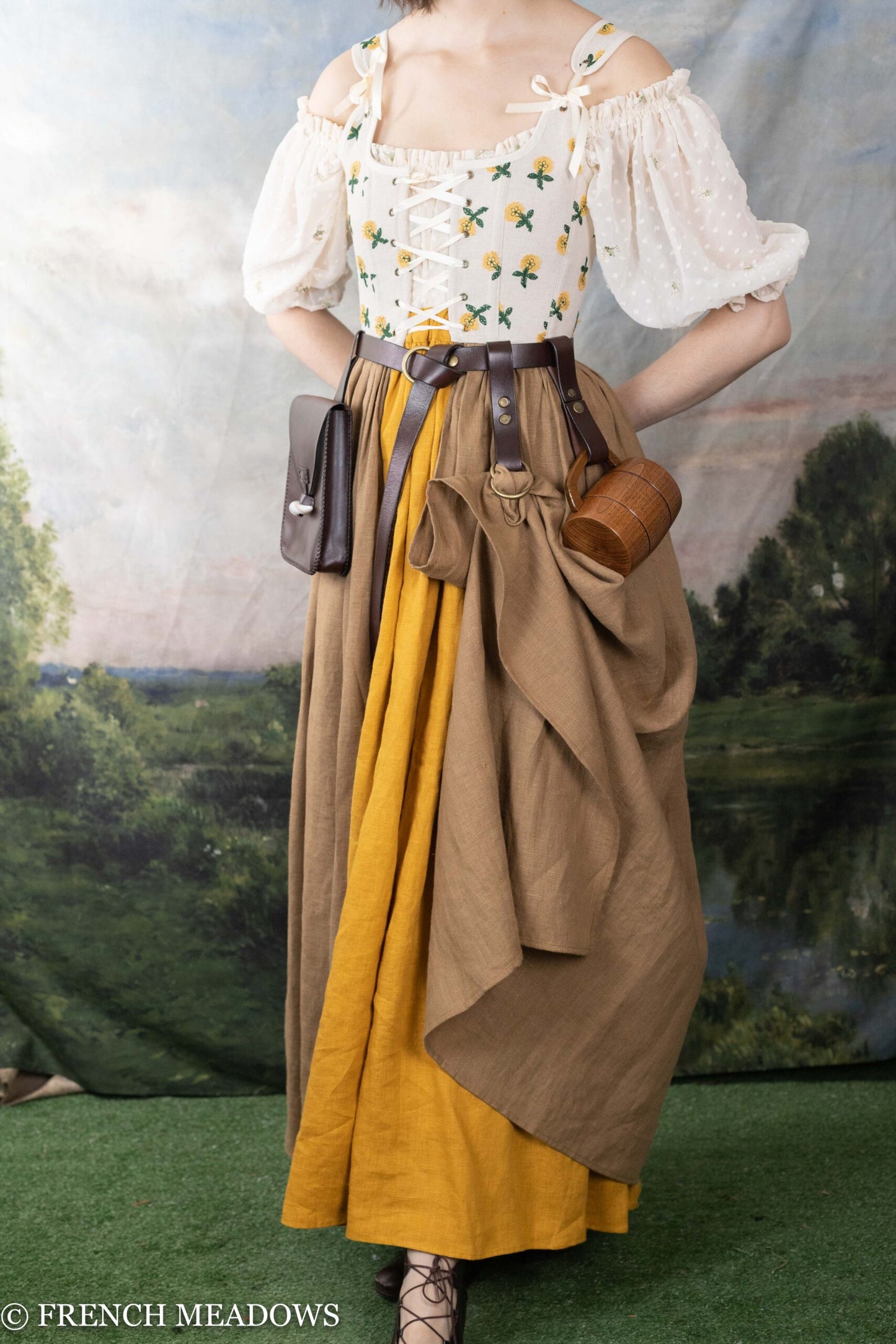 Leather Tankard Strap shown on medieval costume with floral bodice and layered brown skirt, attached to leather belt with pouch