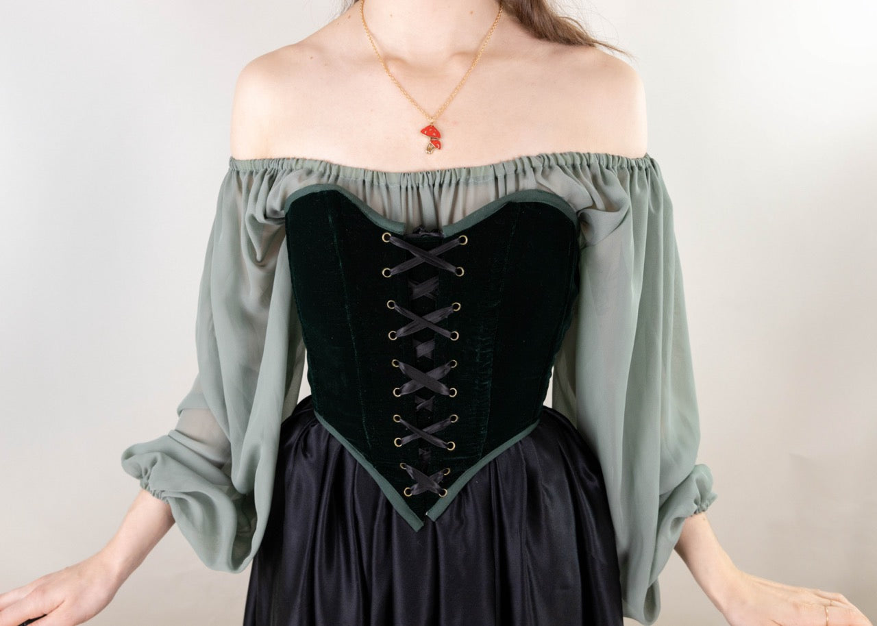 Handmade Green Velvet Renaissance Corset worn with off-shoulder blouse and lace-up front detail in black velvet fabric.