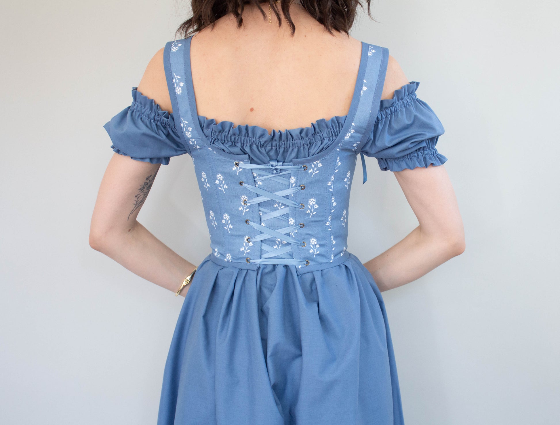 Handmade Blue and White Floral Regency Stays - Size XS shown from the back with lace-up detail and floral pattern on blue fabric